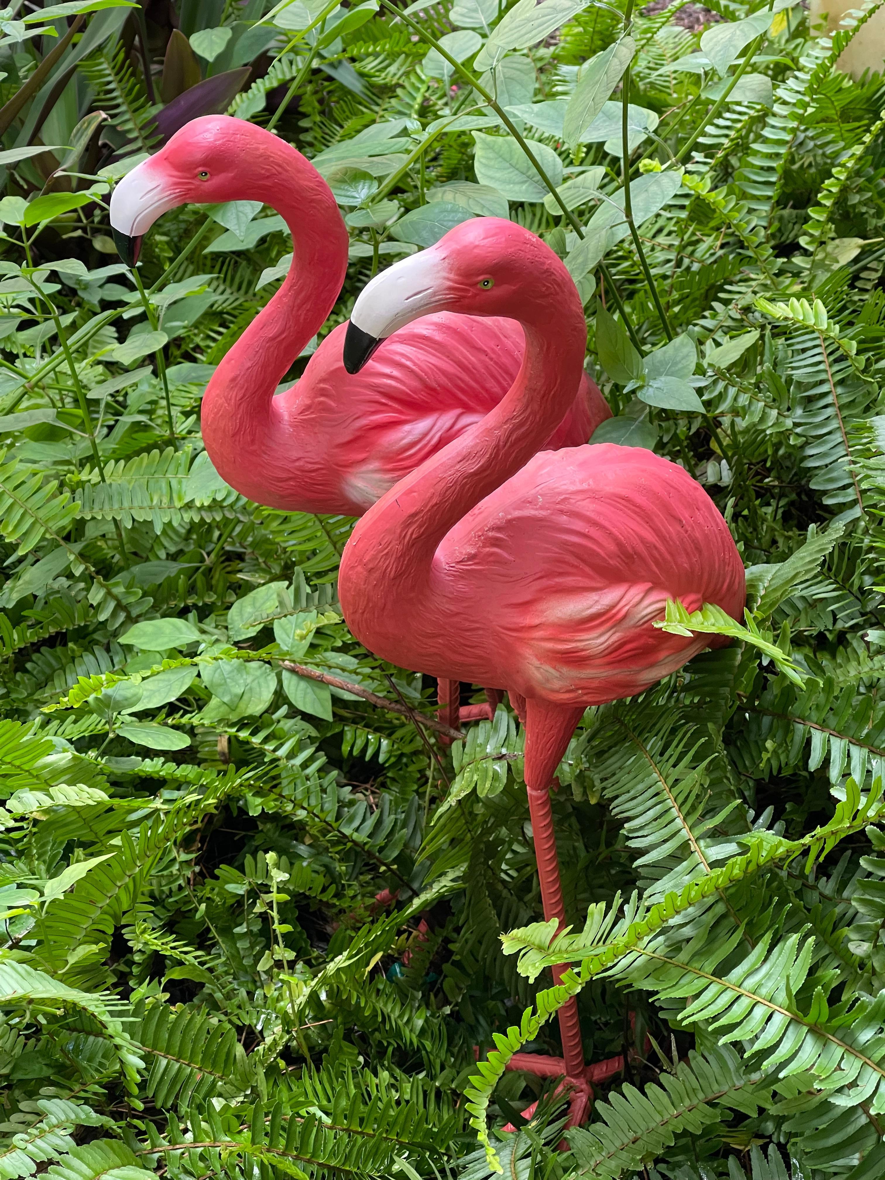 Vintage pair of garden flamingo sculptures.