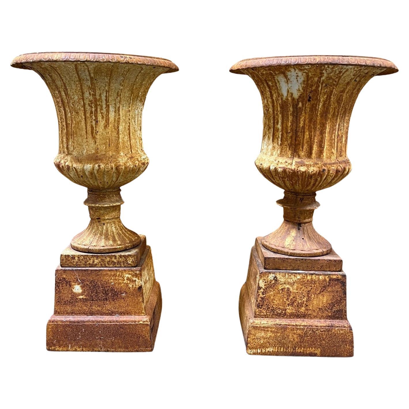 Vintage Pair of Fluted Cast Iron Urns on Square Bases For Sale
