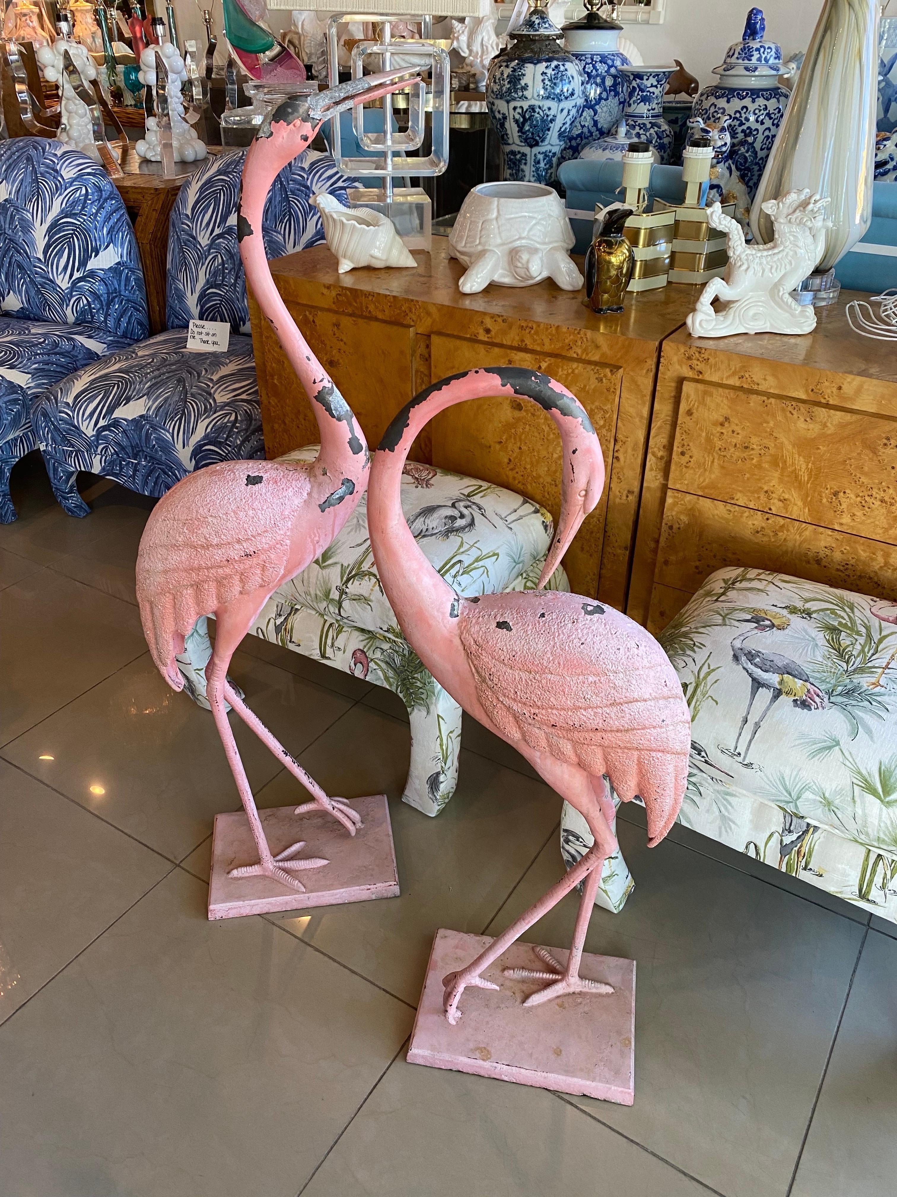 Lovely pair of vintage metal French chippy paint pink flamingos. These have such beautiful layers of chippy pink paint that I left them as is. If you want them painted or powder coated that can be done as well. The one metal base has chipped metal