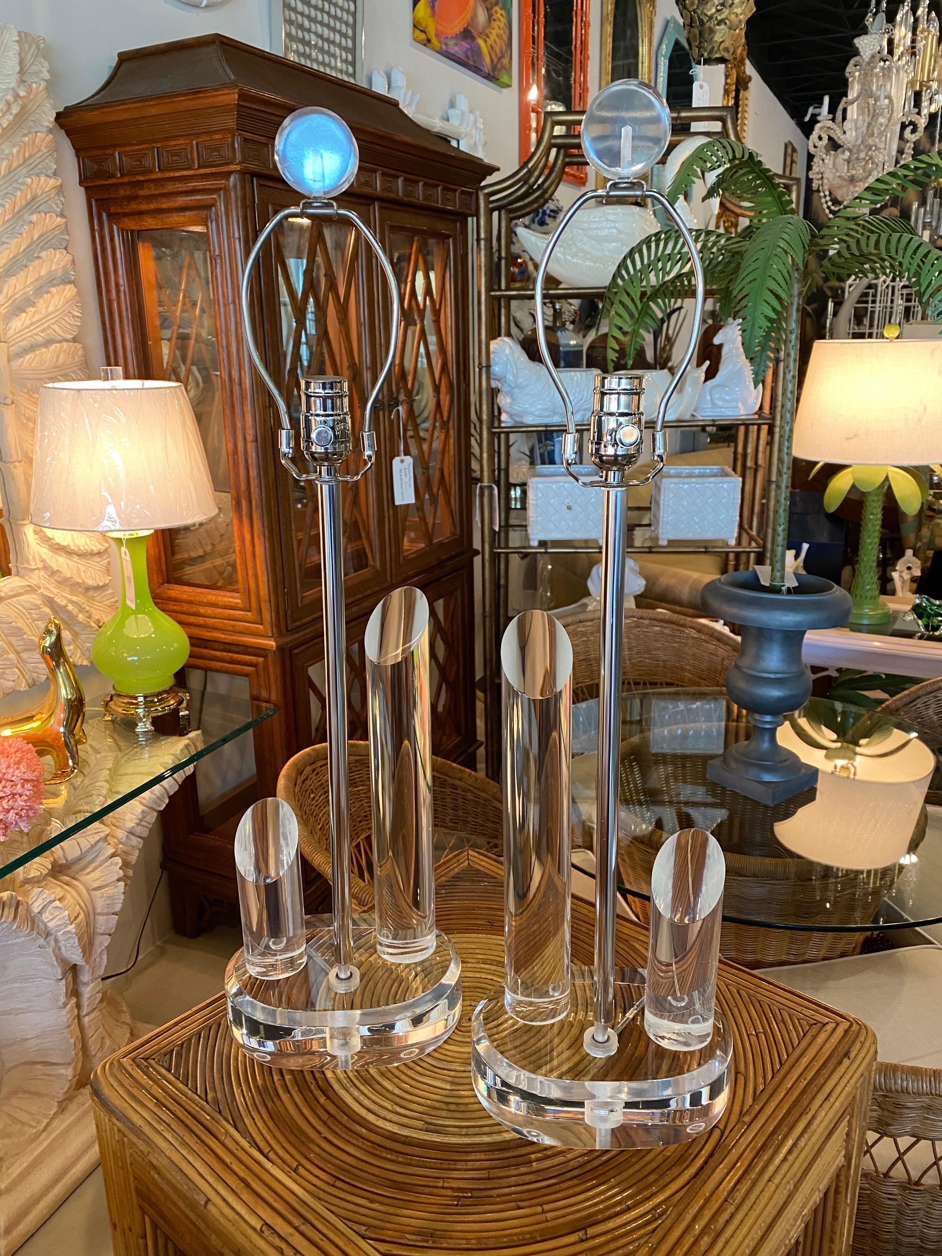 Vintage pair of geometric Lucite table lamps with chrome hardware and Lucite finials. Newly wired. All new chrome hardware.
Measures: Height to socket 21