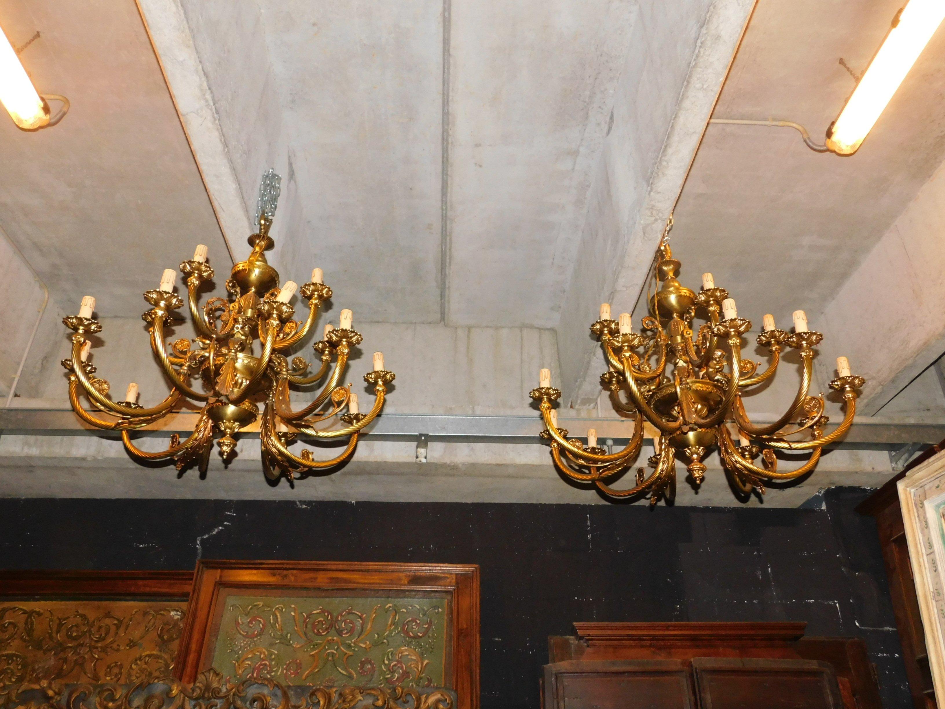 Vintage antique pair of gilt bronze chandeliers, very decorated and sculpted with twisted leaves and arms, many arms lights (15 for each chandelier), from the ceiling, review the electrical system, produced in the 1940s in Italy.
Suitable for a