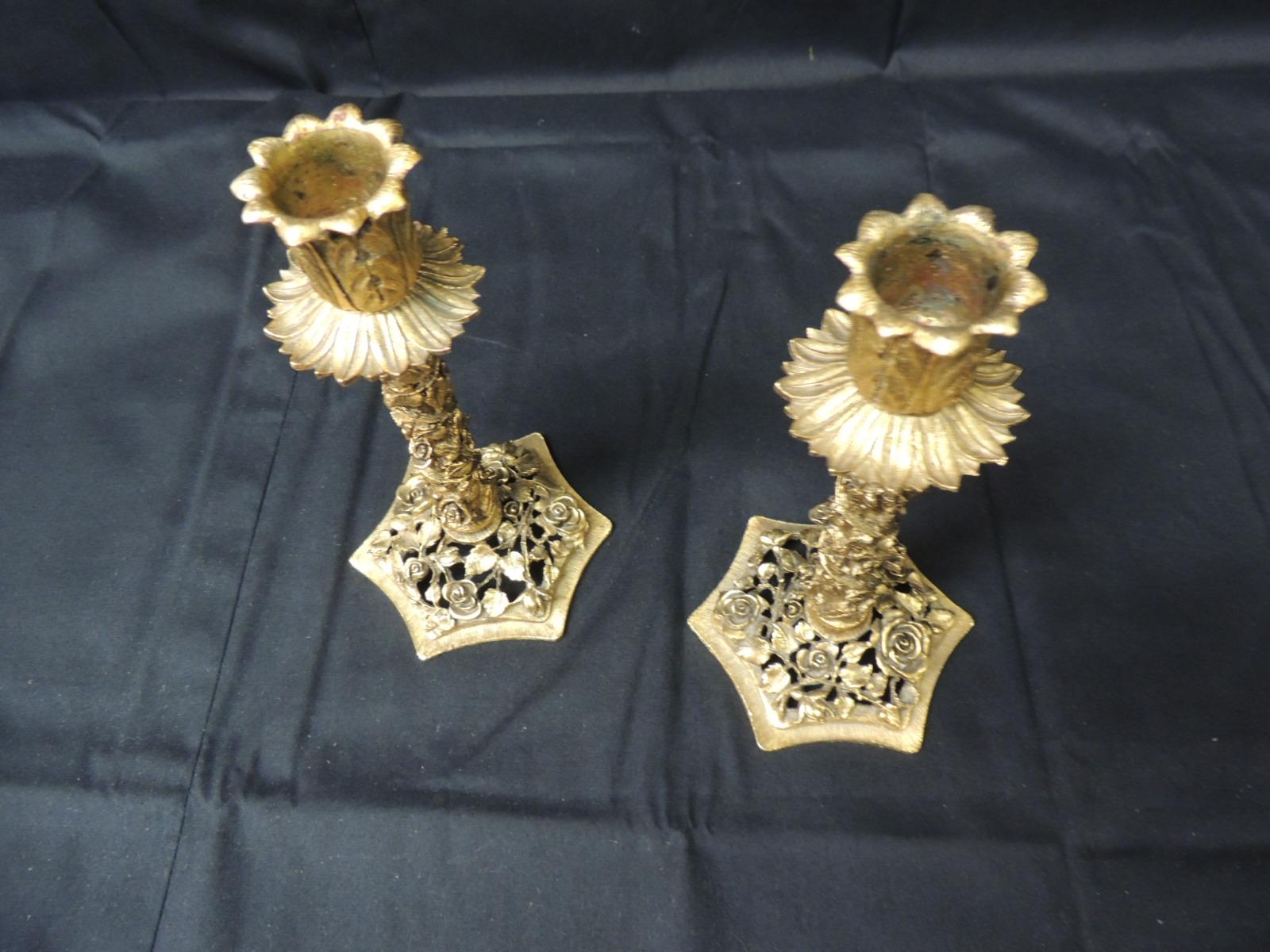 Vintage pair of candlesticks with elaborate filigree of roses and flowers.
(heavy) by Matson
Size: 4 x 4 x 7 H.