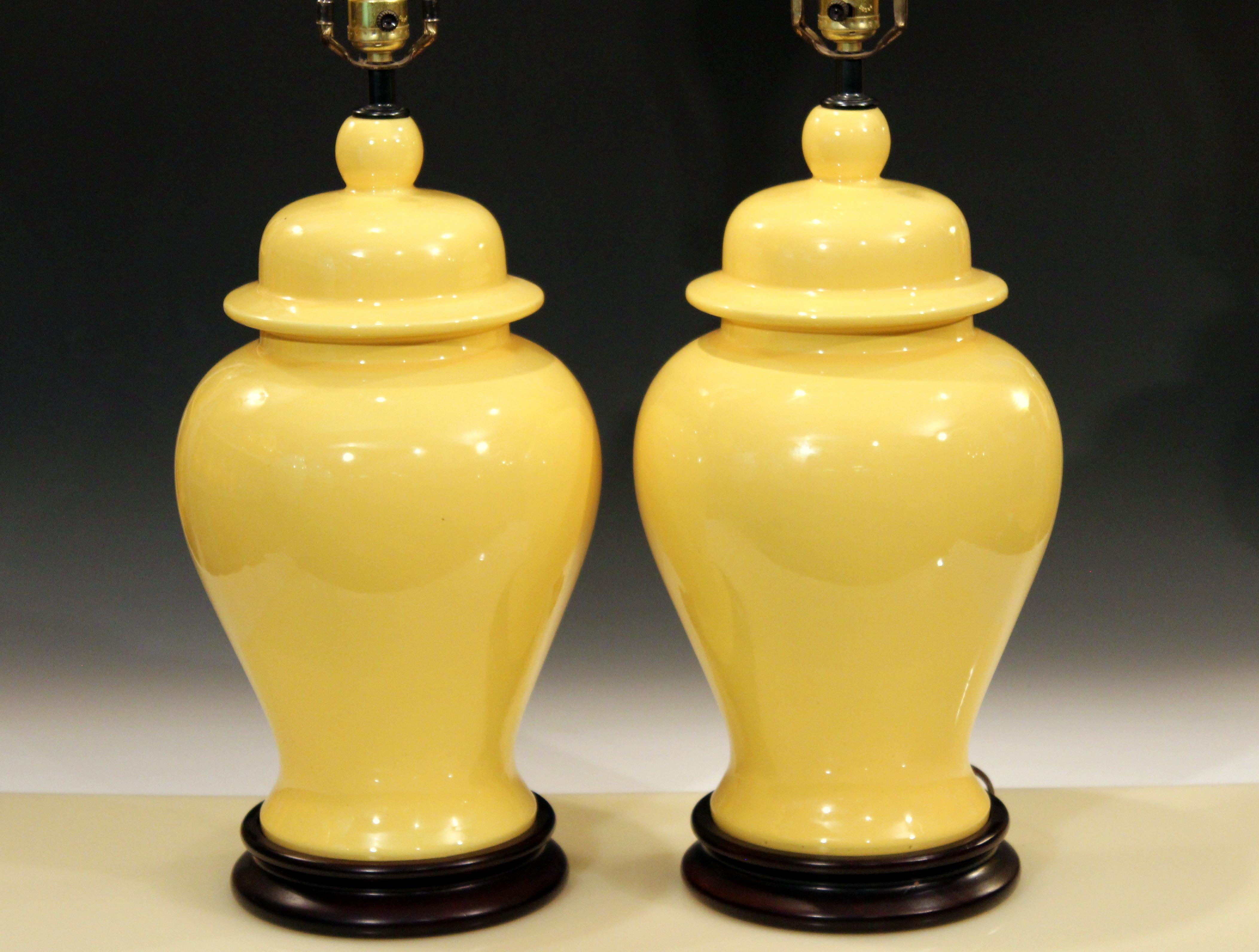 Large vintage pair of Haeger pottery lamps in bright sunny yellow glaze, circa 1970s. Three-way switch. Measures: 33