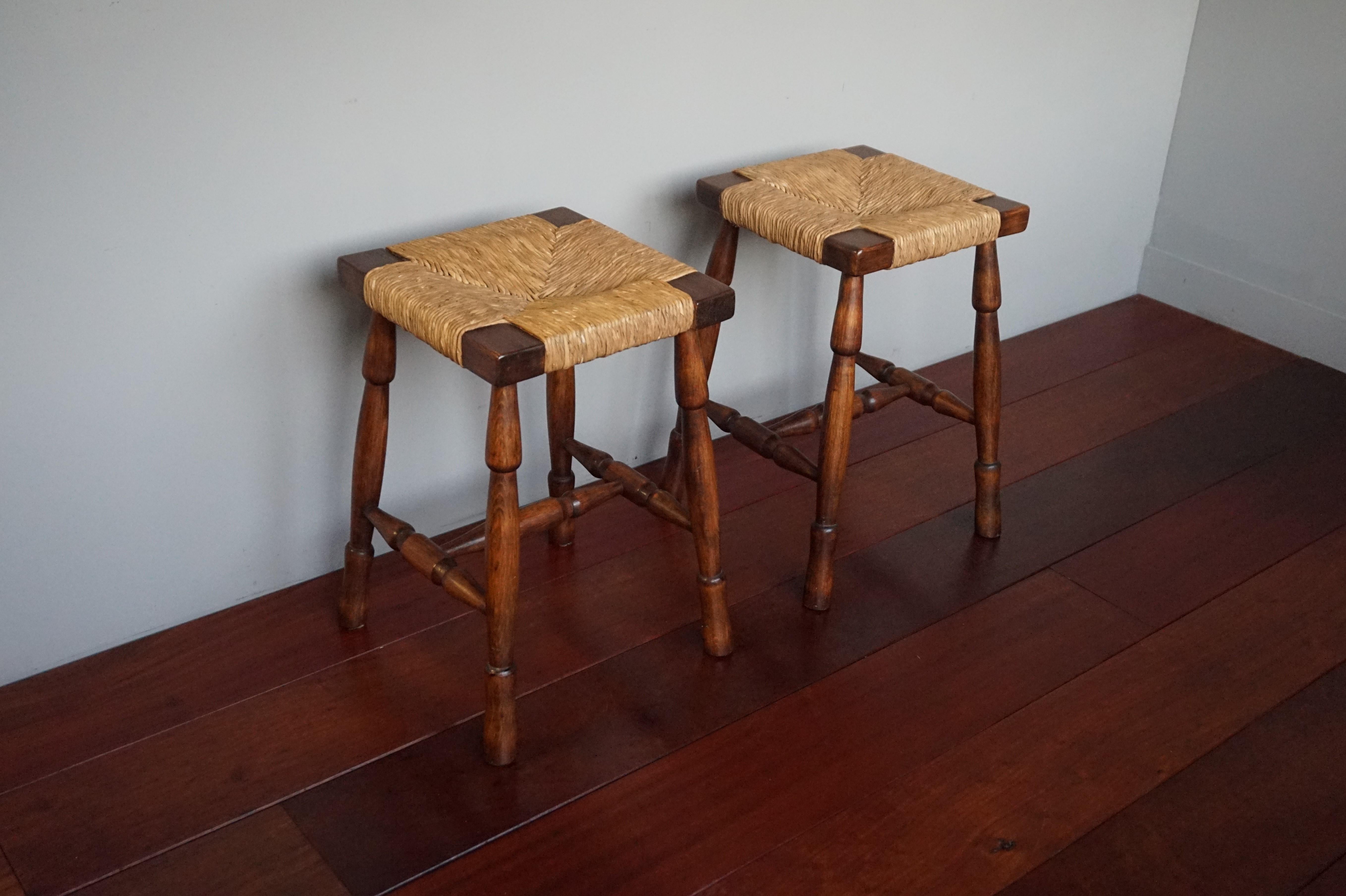 Mint pair of semi-antique stools with handwoven rush seats.

Finding this rare pair of vintage stools was a treat and to have found them in this amazing condition made this find even more rewarding. When you are looking for good and rare pieces in