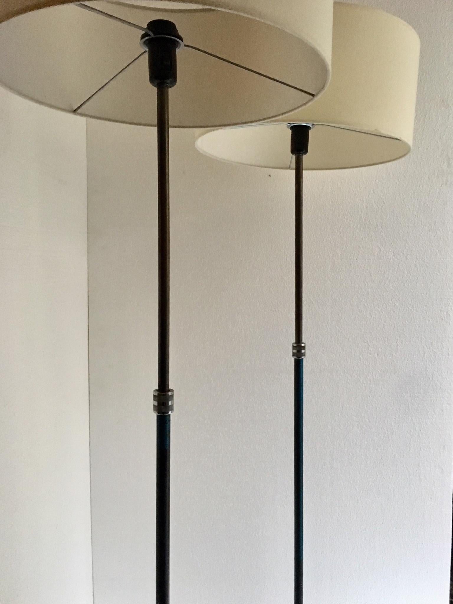 Vintage industrial lamps, in cast iron and chrome metal, the base is a tripod with traces of blue paint, the lamps are adjustable. All the electrical installation has been restored.