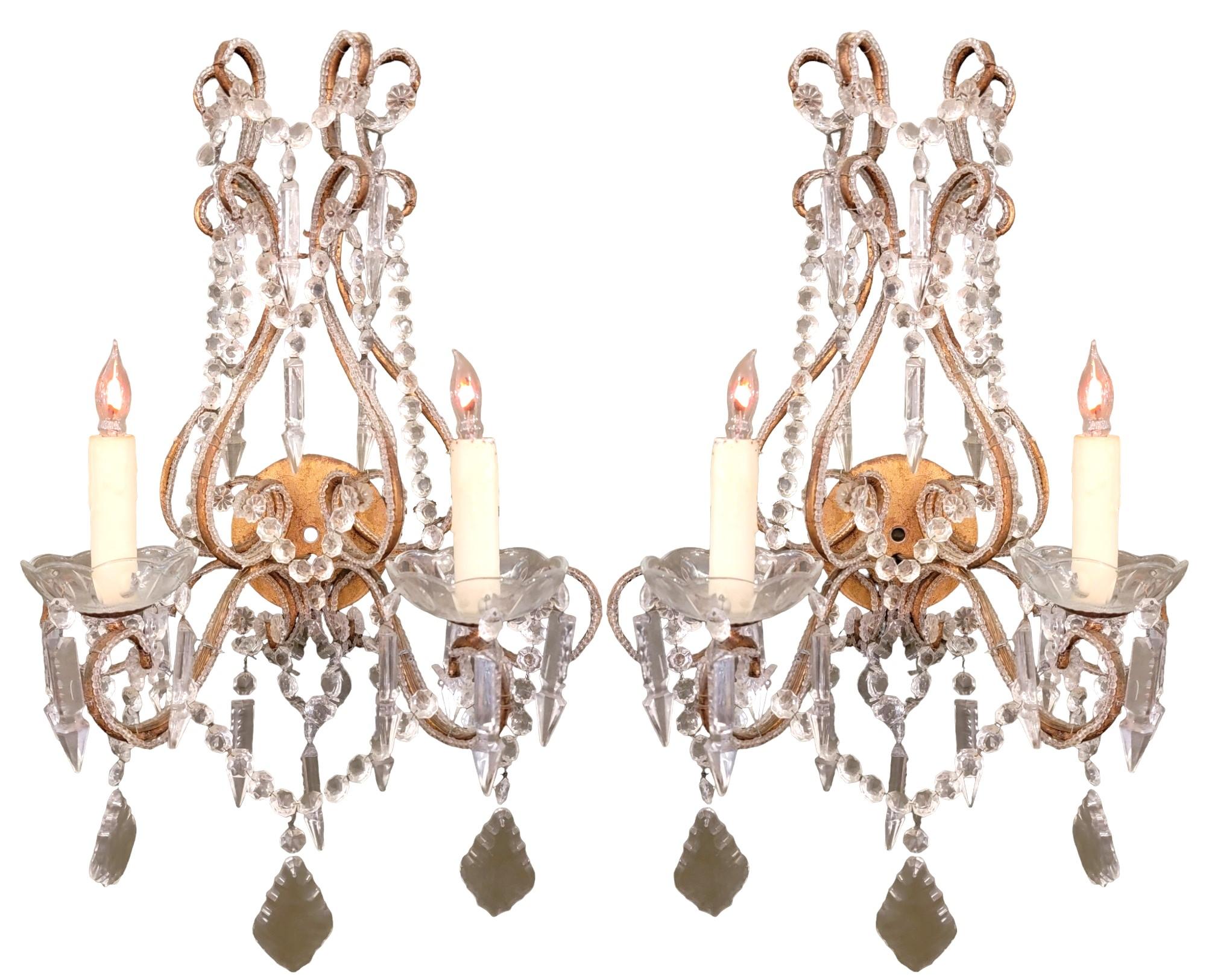 Pair of French Crystal and Brass Sconces each with double lights Wonderful patina.