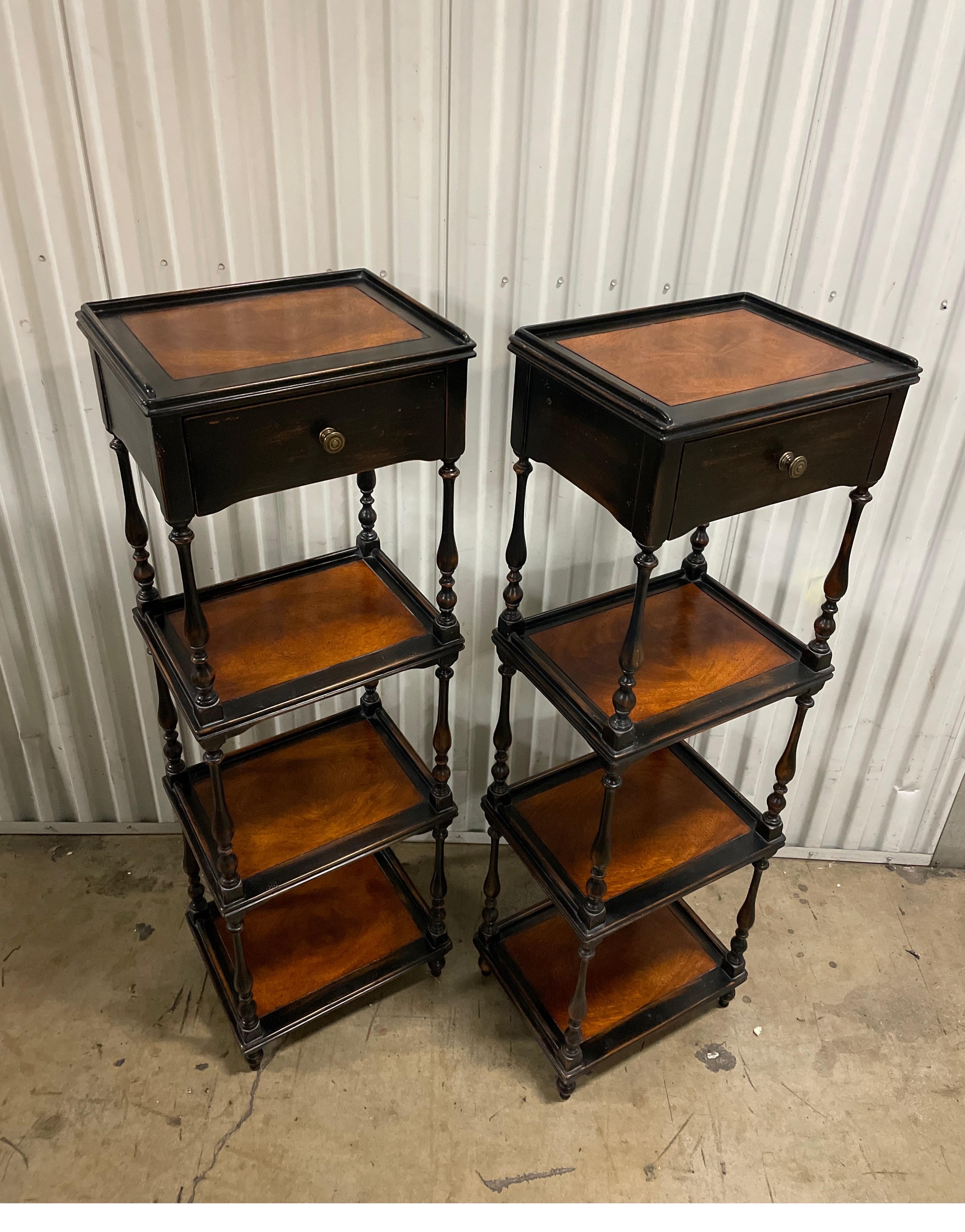 Vintage pair of etageres / bookcases with three shelves below a top drawer.