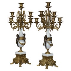 Paire de chandeliers italiens en métal doré avec chérubins figuratifs par Brevettato