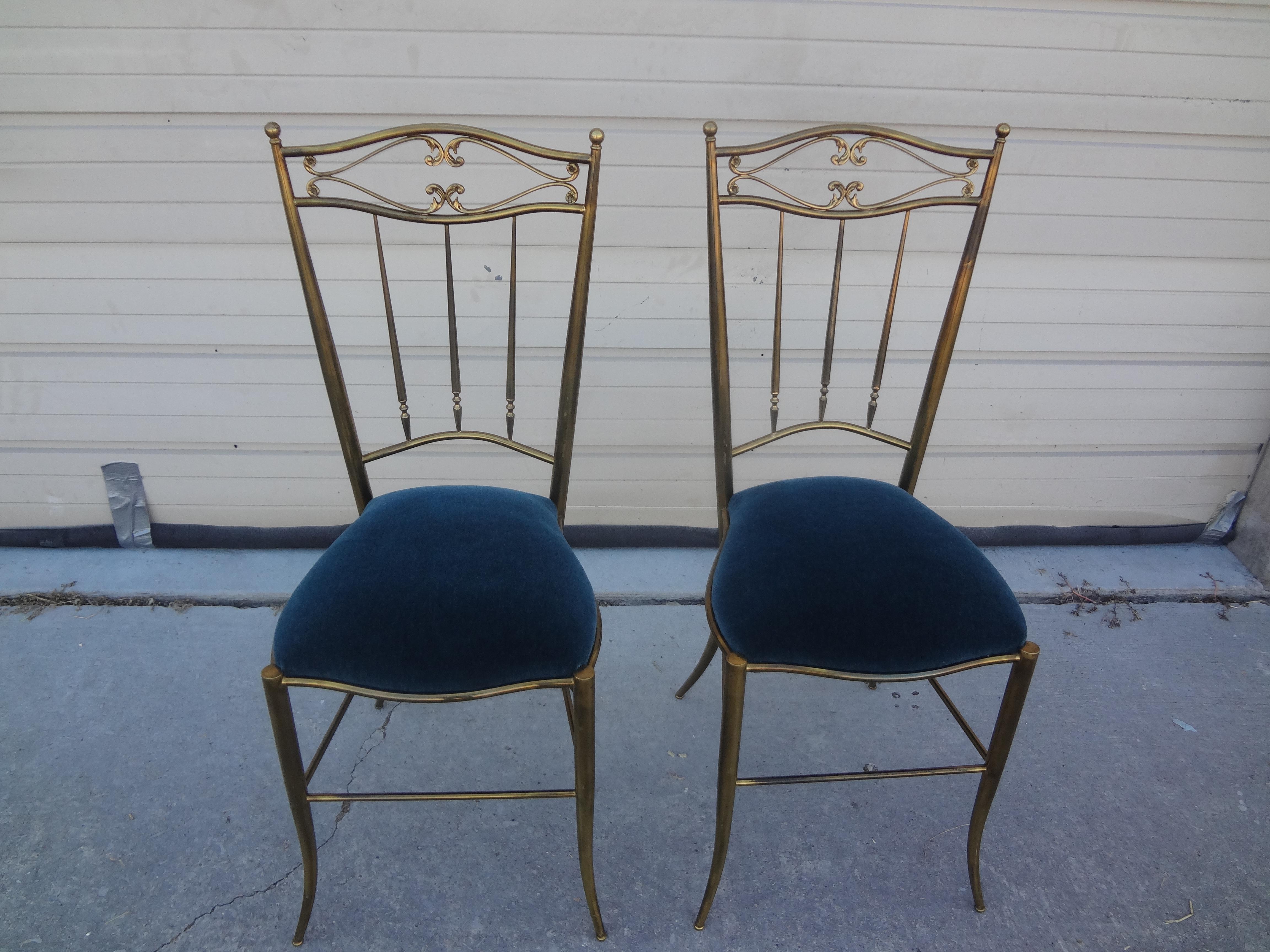 Pair of Italian Neoclassical style brass Chiavari side chairs. This stunning pair of vintage Italian Chiavari chairs are newly upholstered in a lovely shade of blue mohair. Perfect flanking a console table, commode or buffet. Great for extra seating