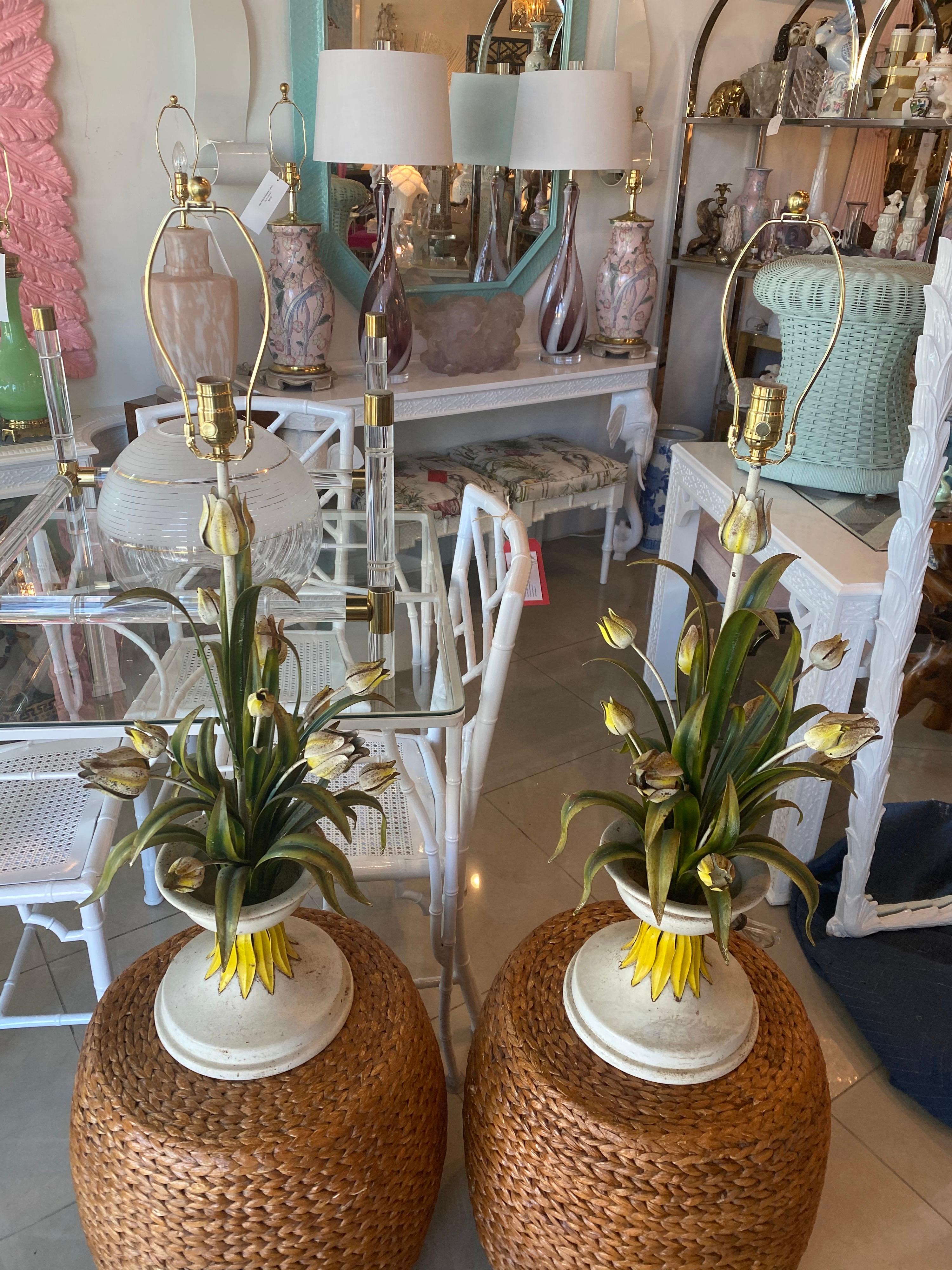 Lovely pair of vintage Italian tole table lamps. Beautiful leaves, flowers and urn. These have wonderful patina which may include chippy paint and rust. These have been newly wired with all new brass hardware and 3 way sockets.
Measures 37 tall to