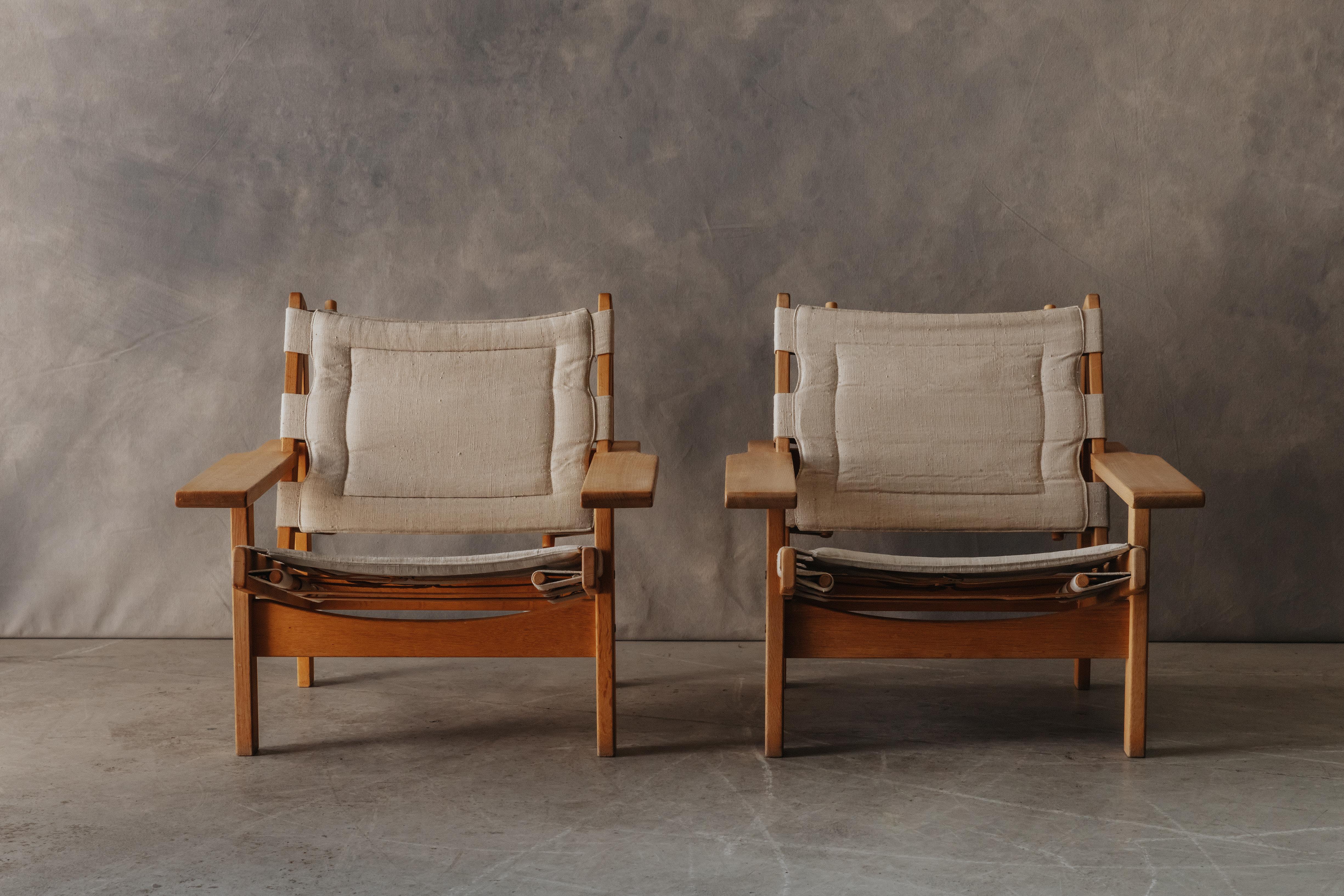 Vintage Pair Of Kurt Østervig Hunting Chairs From Denmark, Circa 1960.  Solid oak construction with original canvas upholstery.  Great condition.