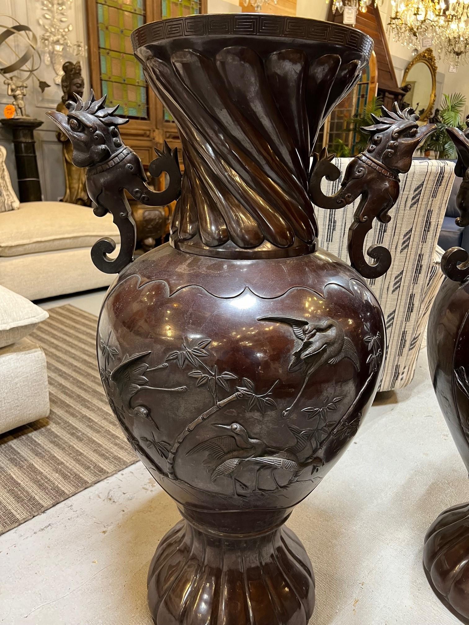 Vintage Pair of Large Japanese Bronze Urns with Cranes & Bamboo Trees   In Good Condition For Sale In Stamford, CT
