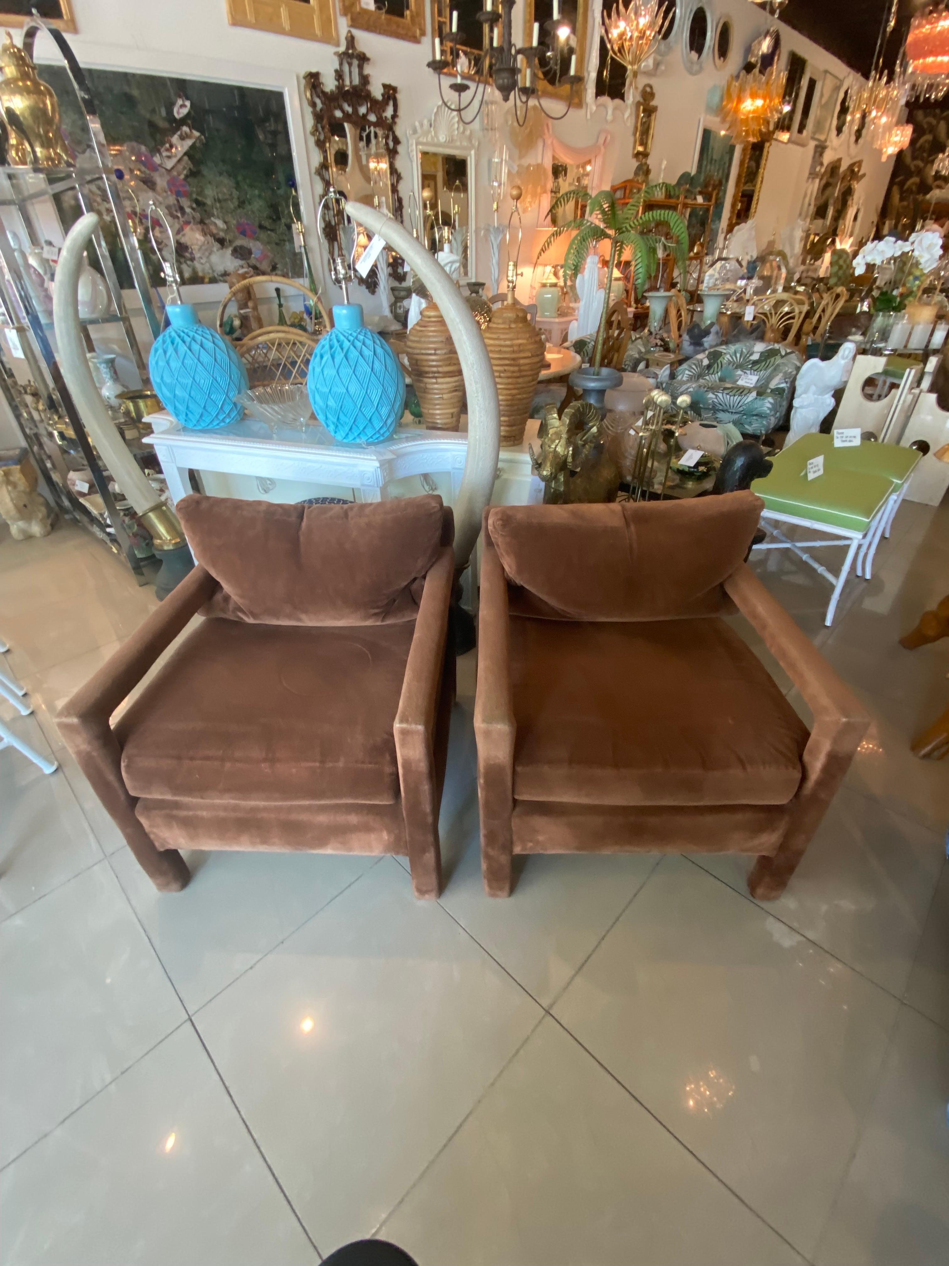 Vintage pair of parsons arm chairs in the style of Milo Baughman. These are large and comfortable! They have their original fabric that will need to be upholstered as it has wear, tear and rips. Has the Karls furniture tag on but makers mark tag is