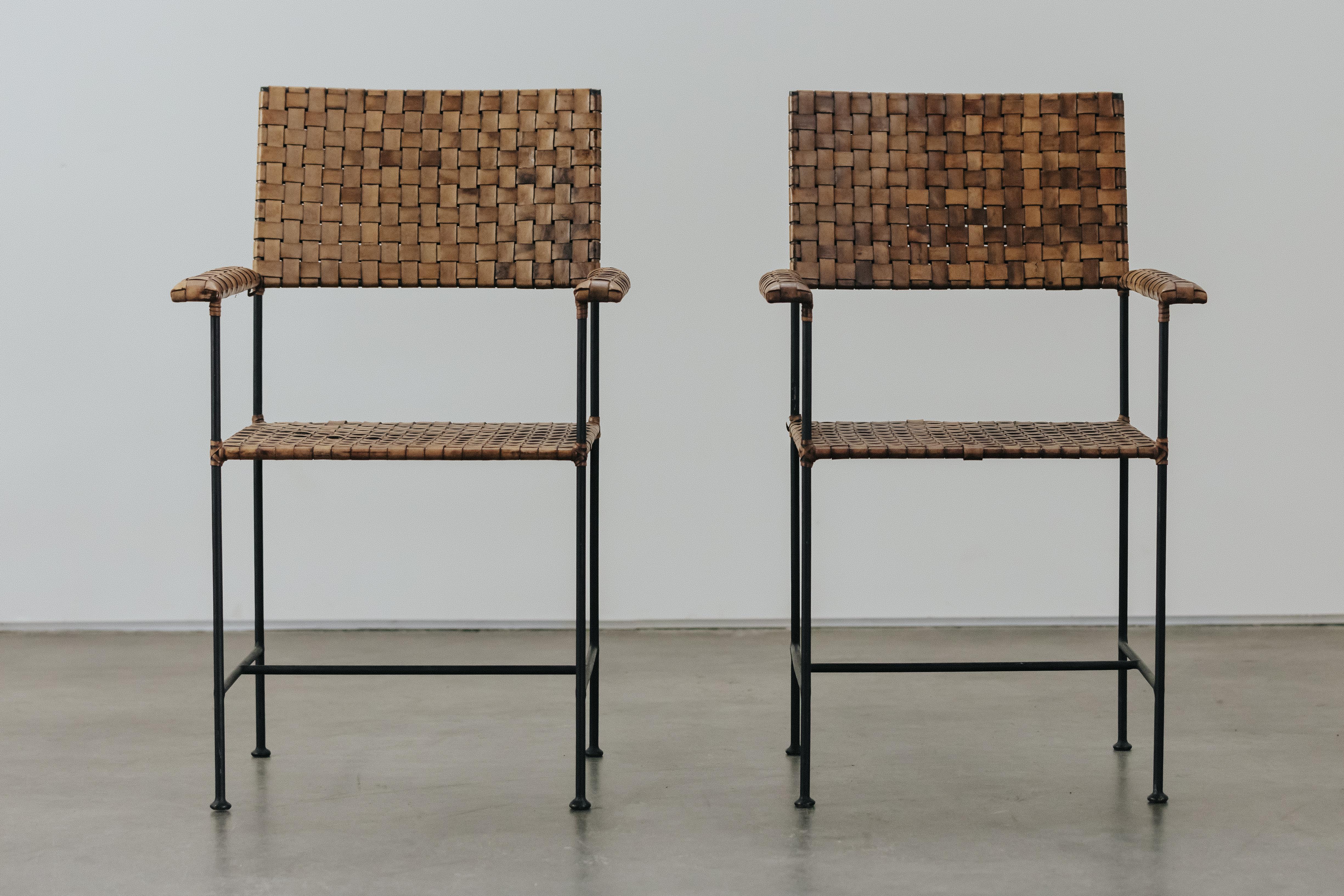 Vintage Pair Of Leather And Steel Chairs From France, Circa 1960.  Solid steel frame with original woven leather seat and back.  Excellent condition.