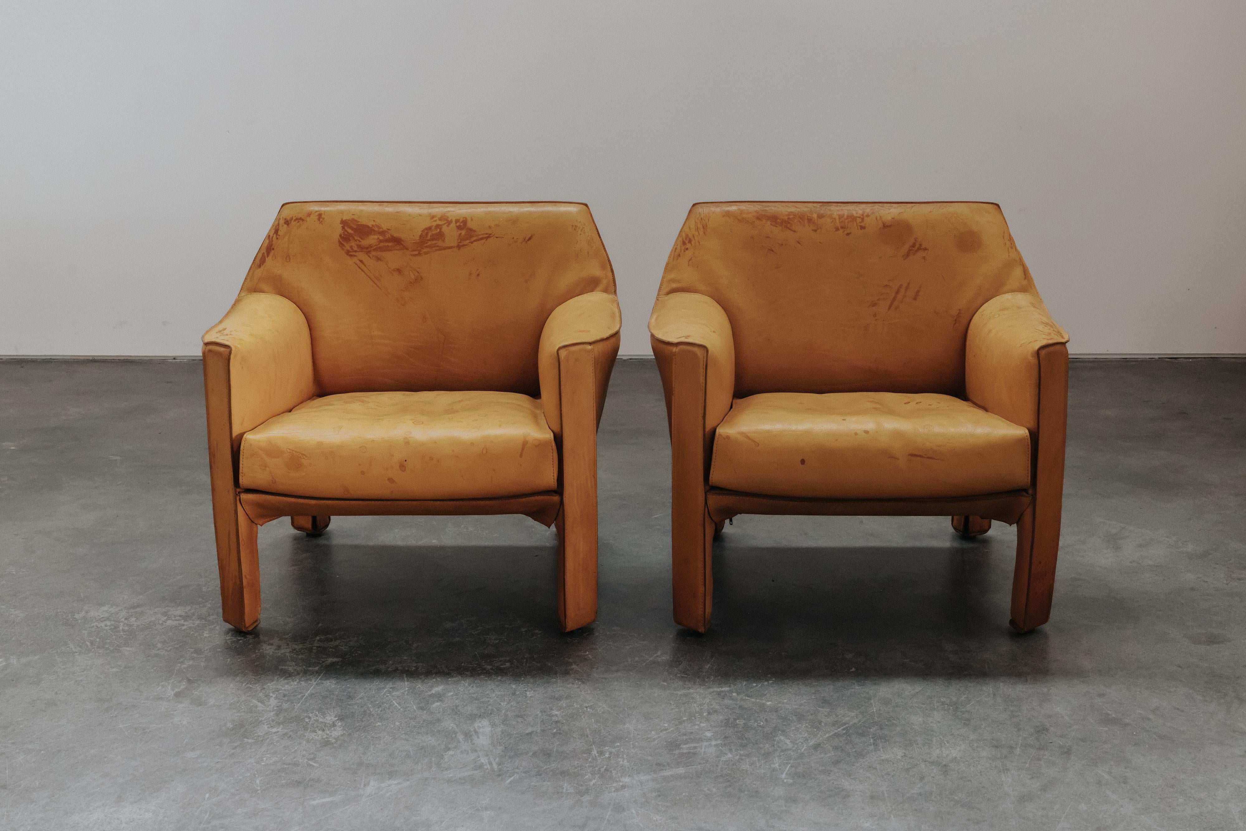 Vintage Pair of Leather Cab Armchairs by Mario Bellini for Cassina, Circa 1970.  Original cognac leather upholstery with great patina and use.