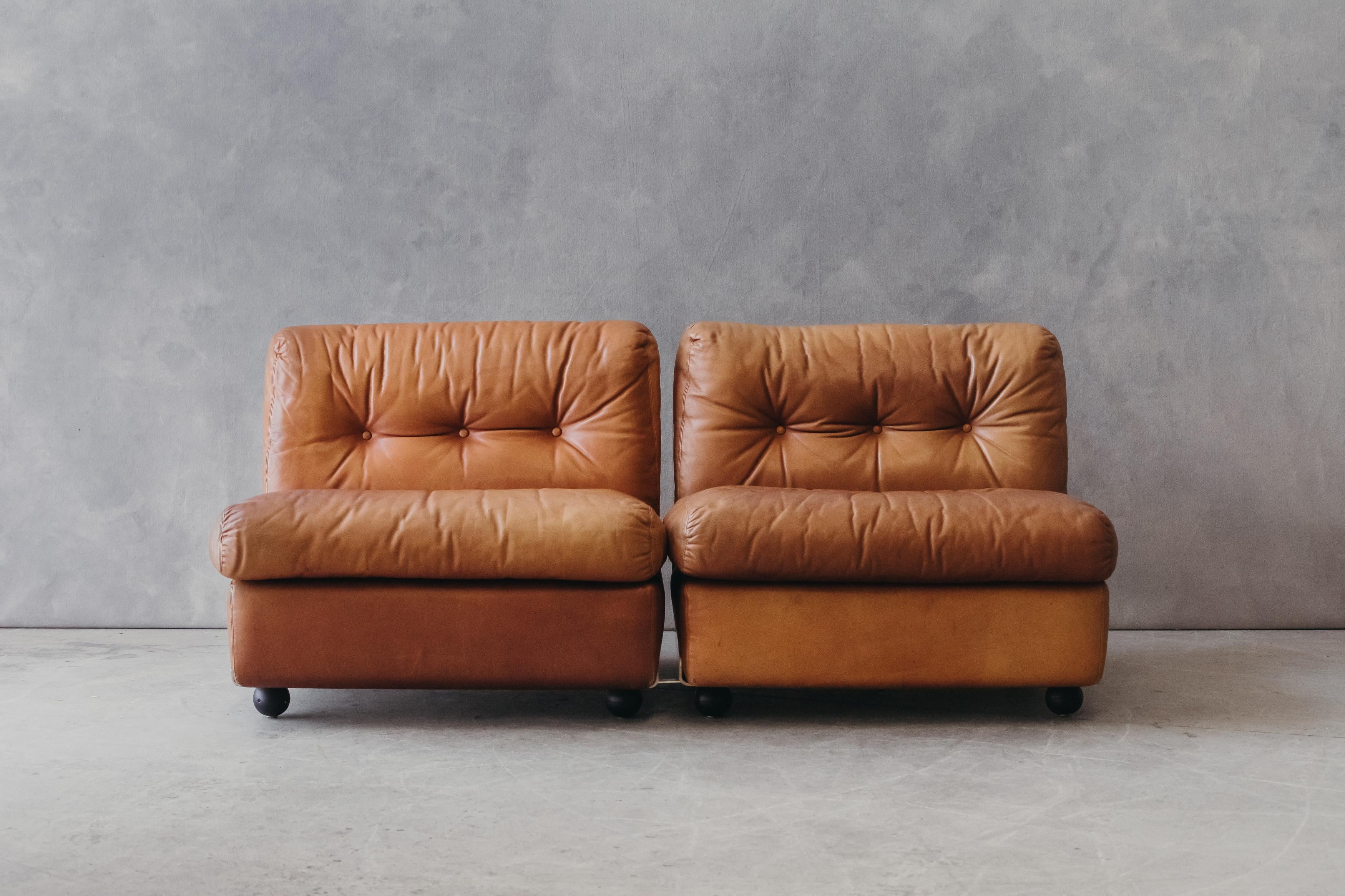Vintage pair of leather lounge chairs by Mario Bellini, Italy, circa 1970. Original cognac leather with great patina. Model 