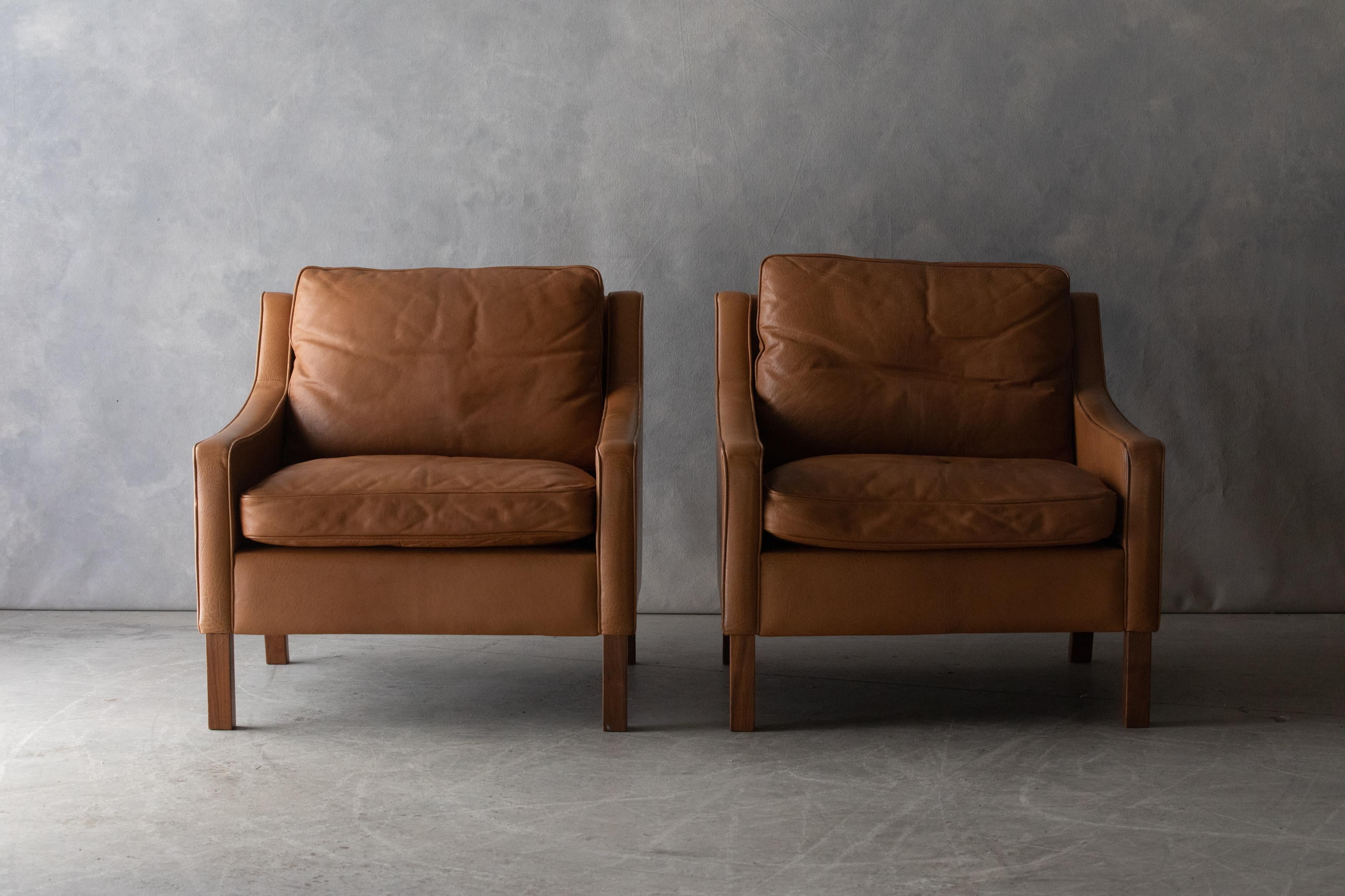 Vintage pair of leather lounge chairs From Denmark, circa 1970. Original cognac leather upholstery with light wear and use. Great condition.

 