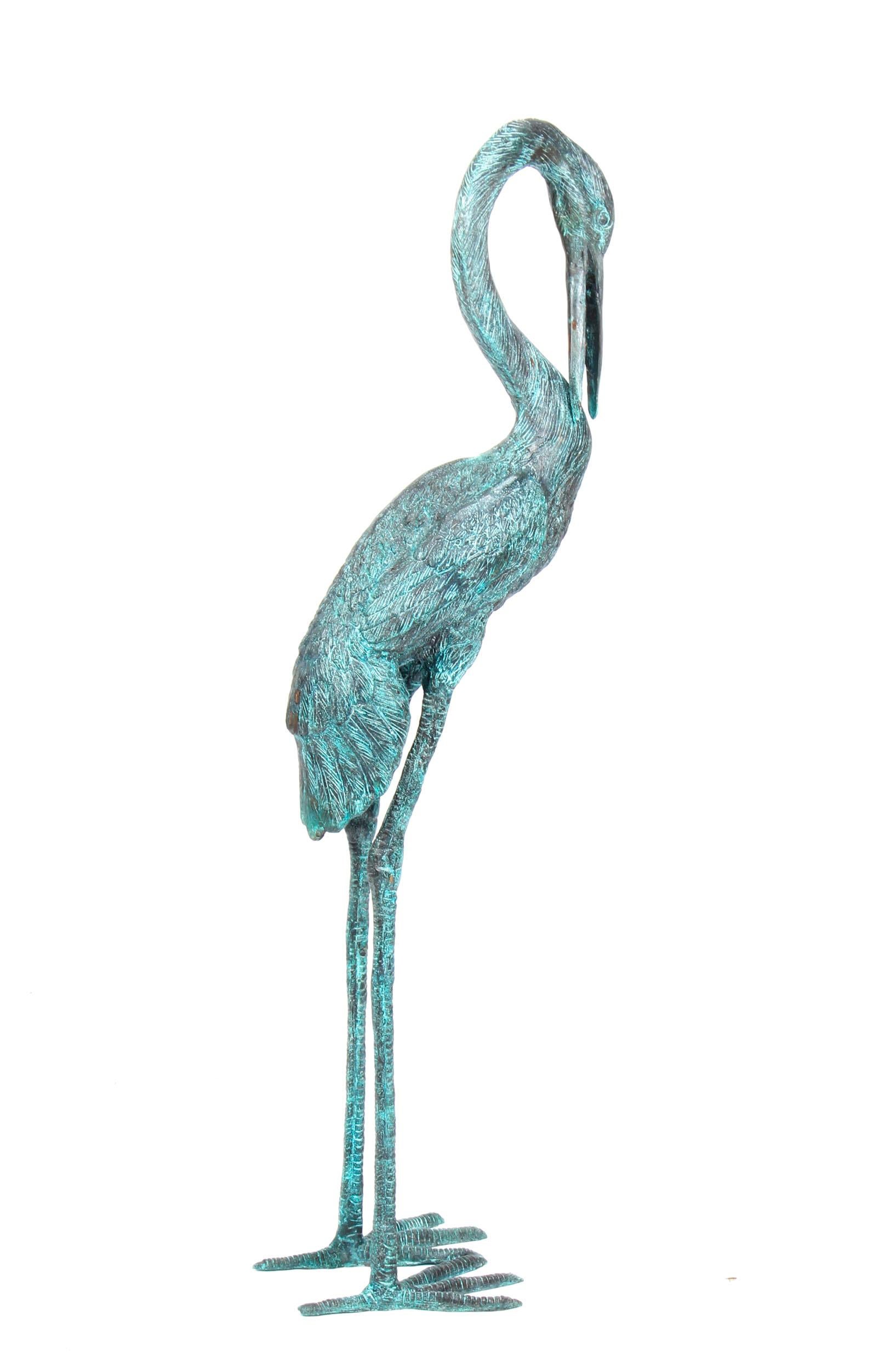 This is a stunning pair of solid bronze cranes with a delightful green patina and dating from the last quarter of the 20th century.

This remarkable bronze pair features the two birds in a highly life-like fashion - with their characteristic long