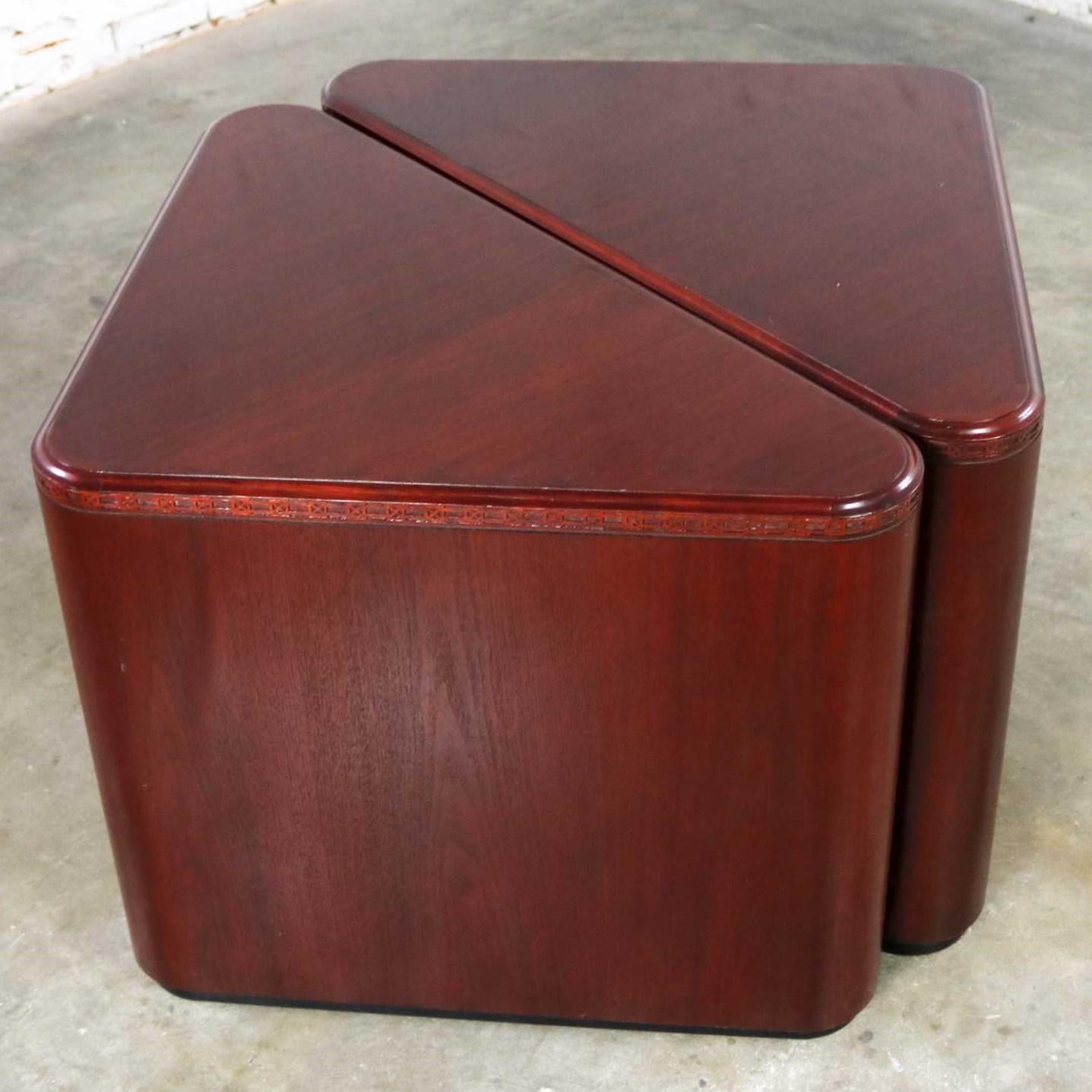 Handsome pair of triangular end tables, side tables or pedestals in mahogany veneer. They have nice detail. Plus, they are in wonderful vintage condition. Please see photos. circa late 20th century.
We were excited here at the shop when we ran