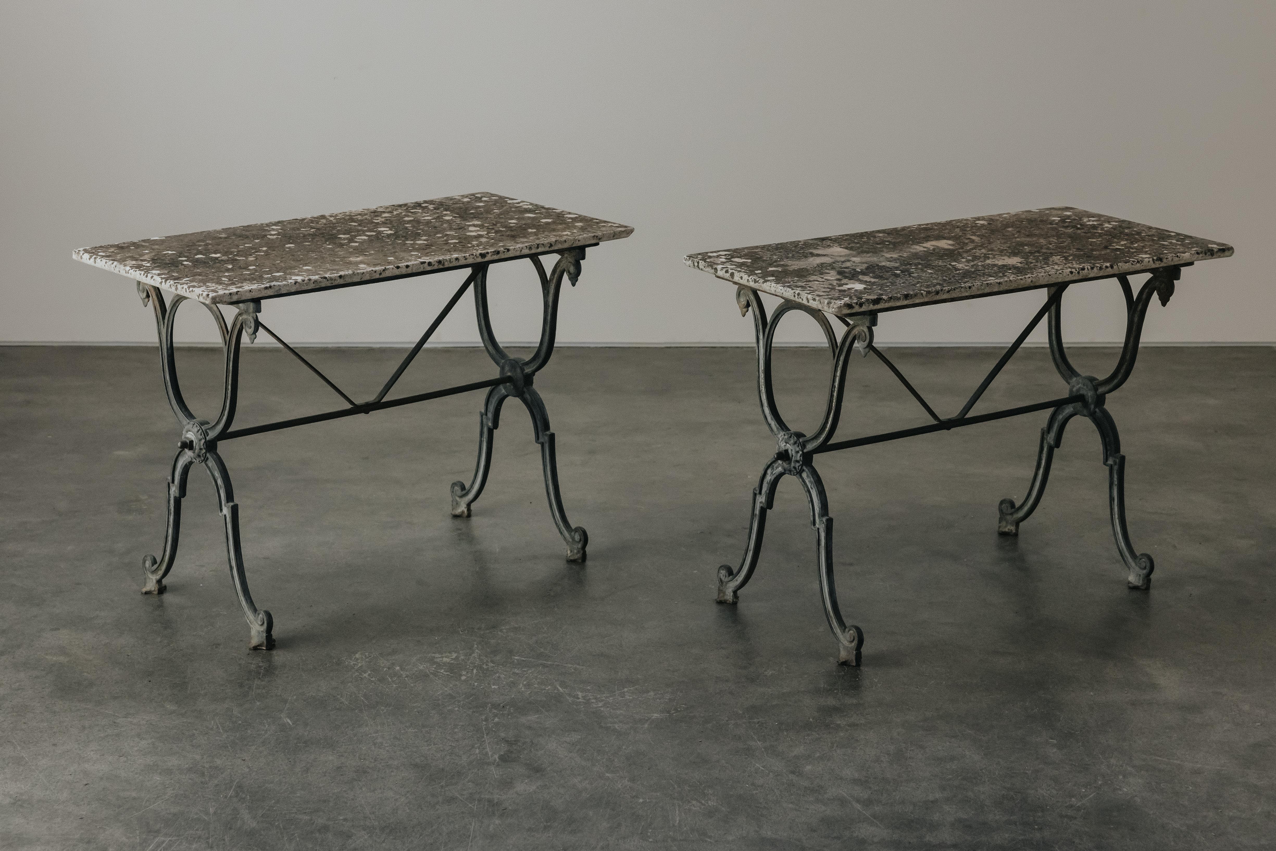 Vintage Pair Of Marble and Iron Garden Tables From France, Circa 1940.  Original white marble top on a cast iron base.  Nice original patina and use.