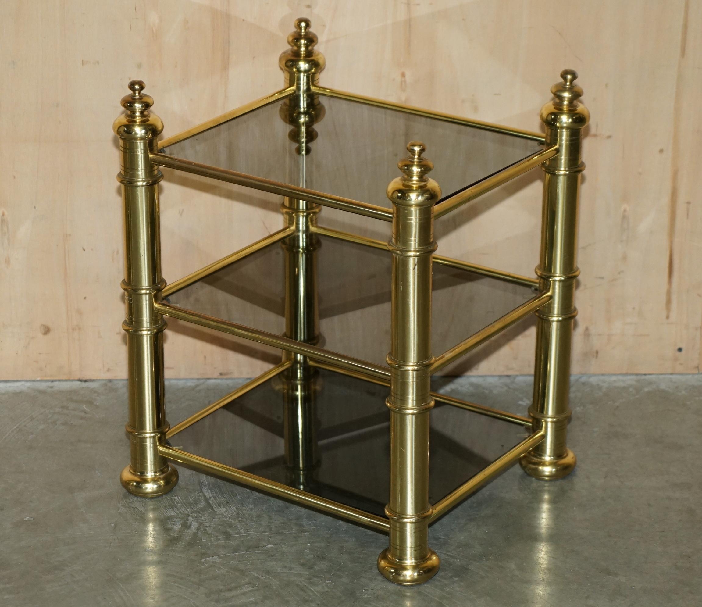 Royal House Antiques

Royal House Antiques is delighted to offer for sale this lovely original pair of circa 1960’s Brass & Smoked glass Etagere side end tables over three tiers  

Please note the delivery fee listed is just a guide, it covers
