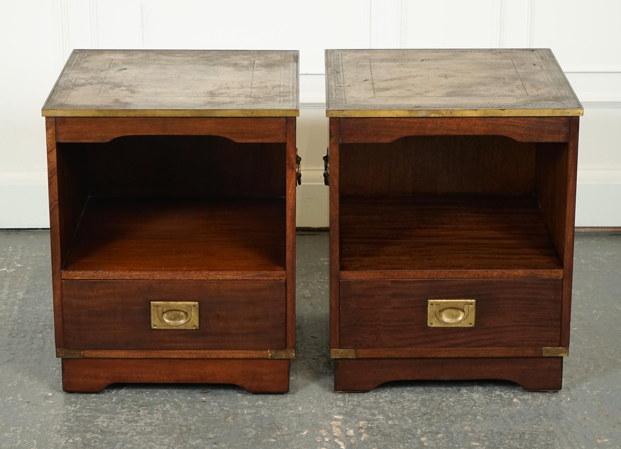 
We are delighted to offer for sale this Vintage Pair of Military Campaign Side Tables.

This set of vintage military campaign bedside tables nightstands is crafted with a rich brown leather top that adds a touch of elegance and sophistication to