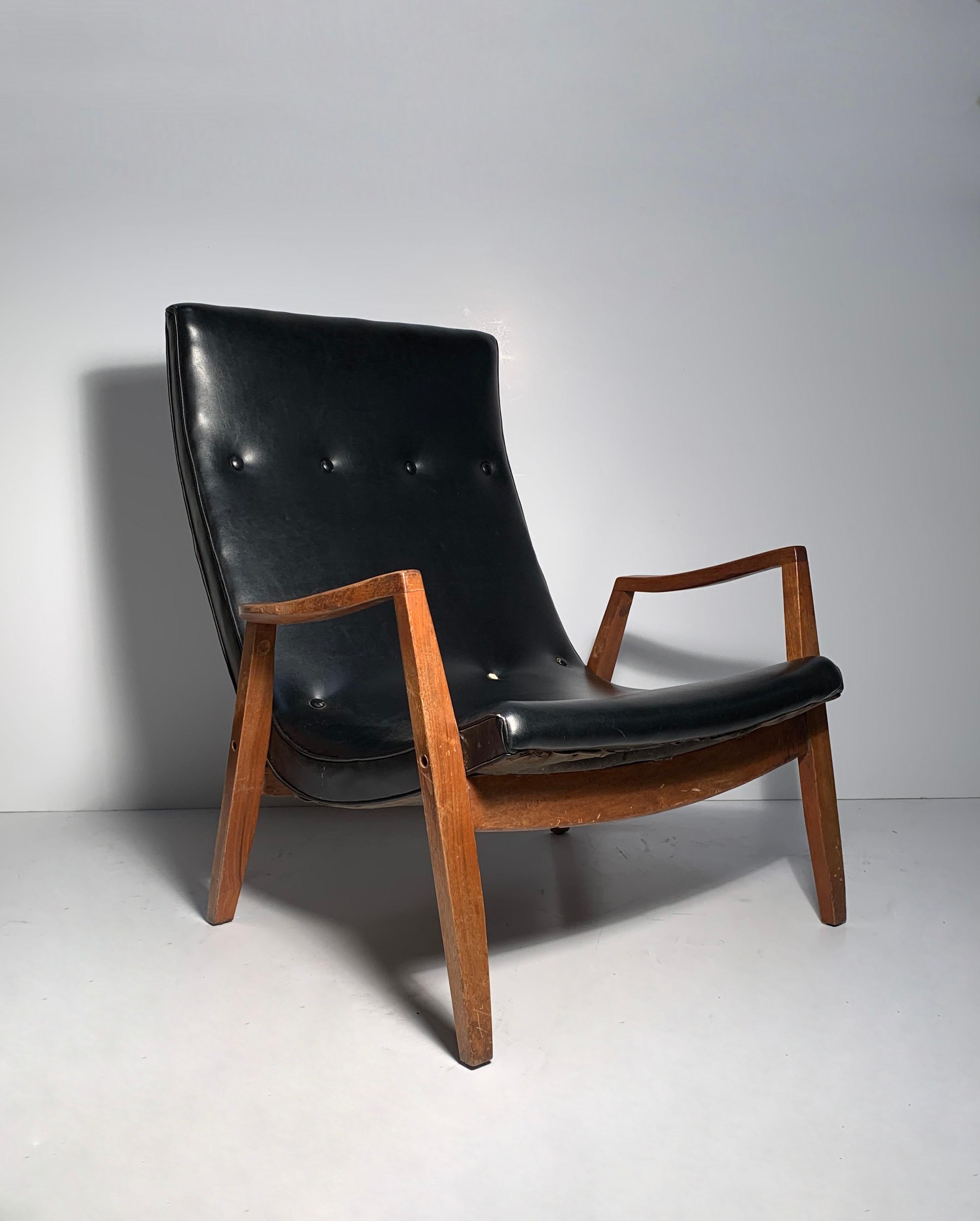 Milo Baughman pair of scoop lounge chairs

Wood frames need some minor restoration and refinishing is probably desirable with these.

Black upholstery is original. Missing a couple buttons which should be an easy fix. otherwise not bad as-is.