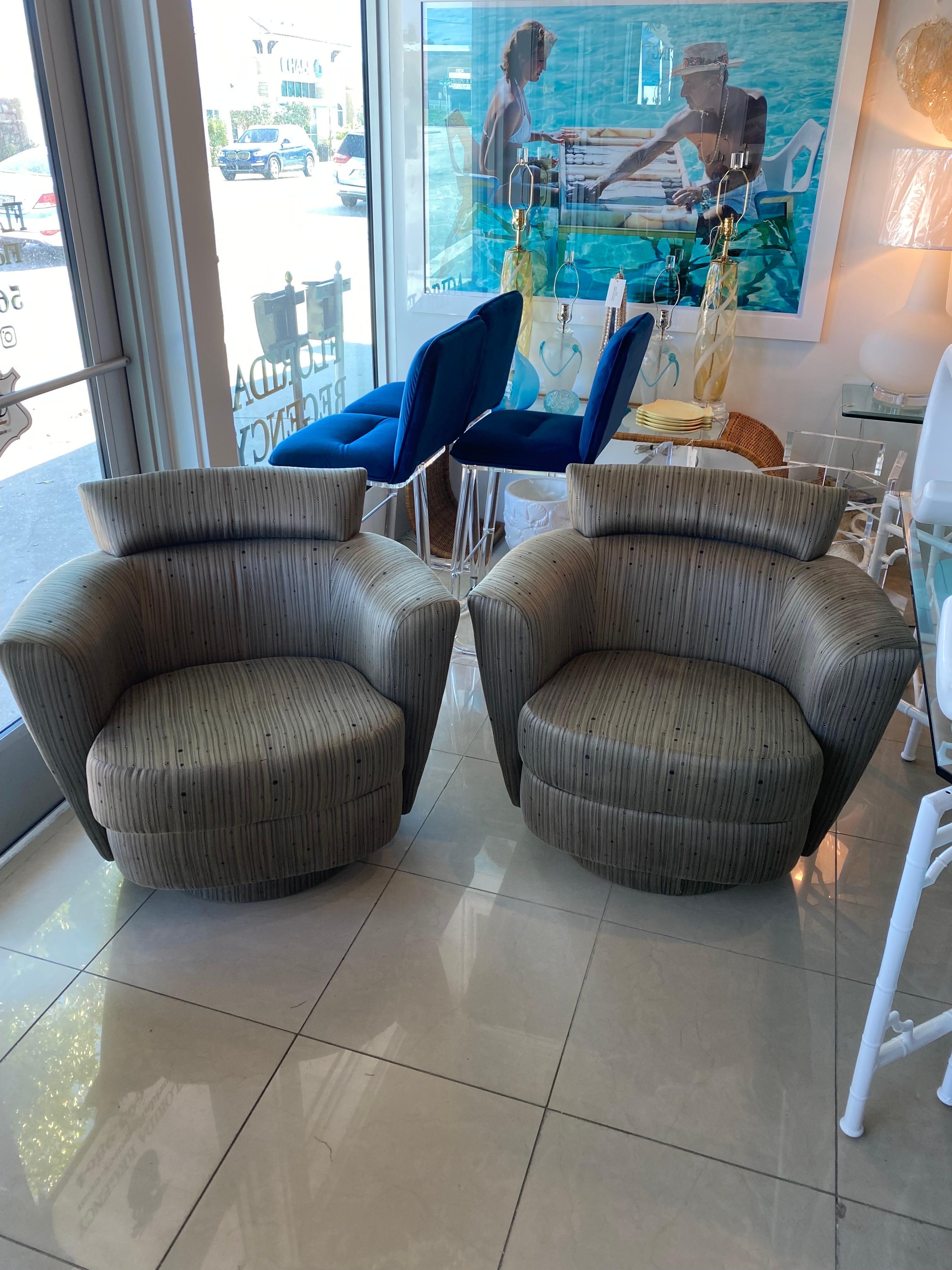 Vintage pair of swivel barrel tub armchairs arm chairs. Original fabric which is in very good condition. If you are keeping the fabric I would be happy to get them steam cleaned prior to shipping if you let me know. Dimensions: 32 H x 38 W x 34