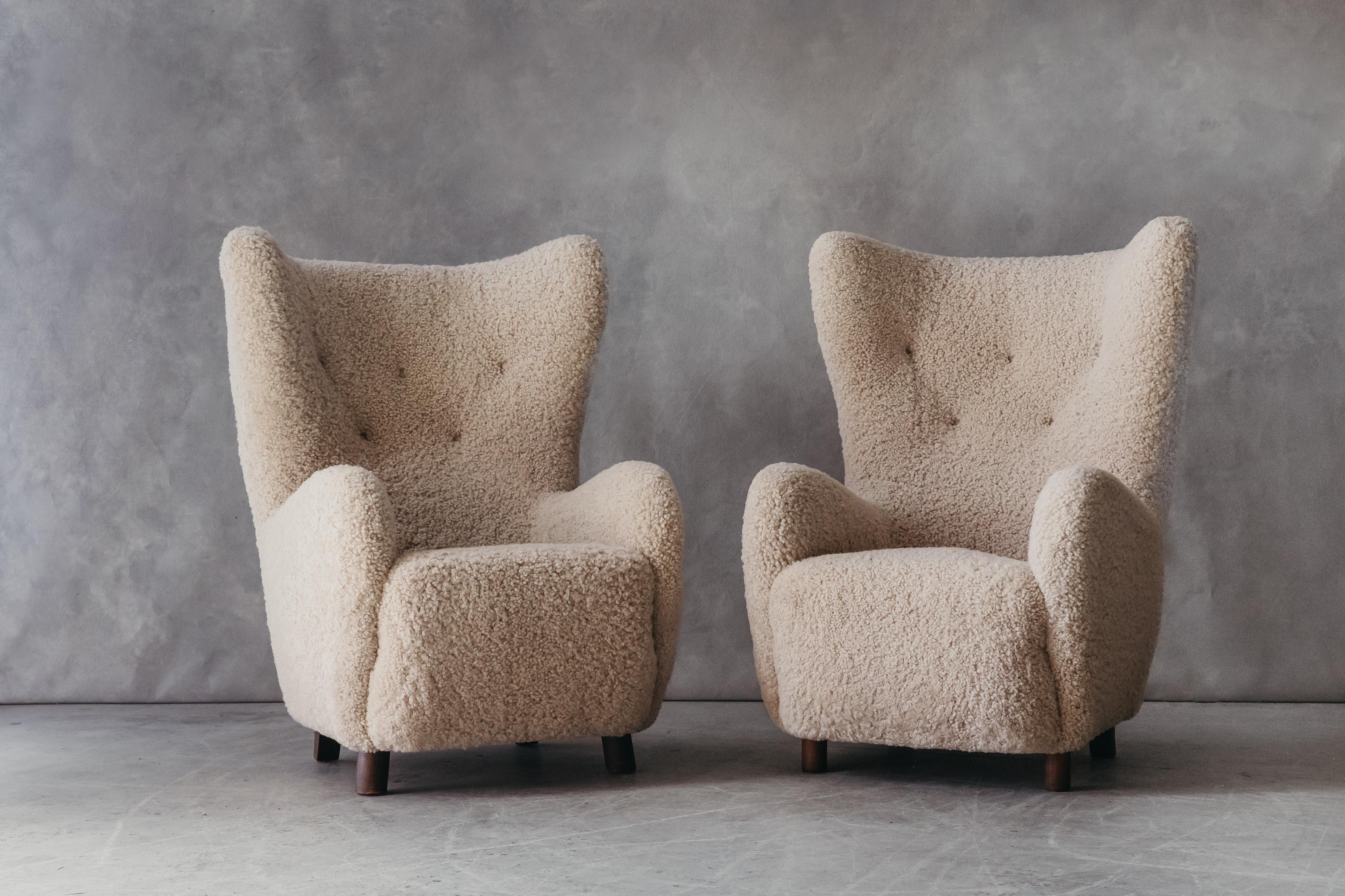 Vintage Pair Of Mogens Lassen Wingback Chairs From Denmark, Circa 1950. Superb pair later upholstered in very soft, off white shearling. Excellent condition.

We don't have the time to write an extensive description on each of our pieces. We