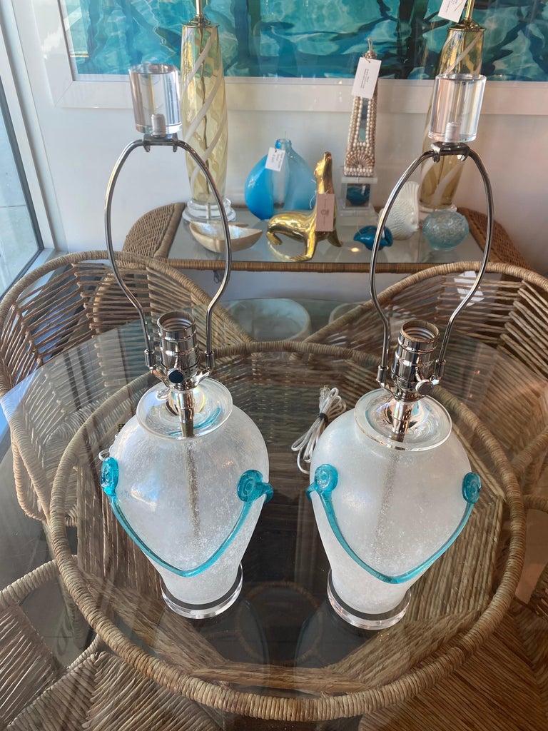 Lovely pair of vintage Murano frosted glass and aqua table lamps. These have been completely restored. Newly wired, all new nickel hardware, 3 way sockets. Lucite base, lucite finials, lucite vase cap. Dimensions: 14.5 H to socket x 22 H to finial x