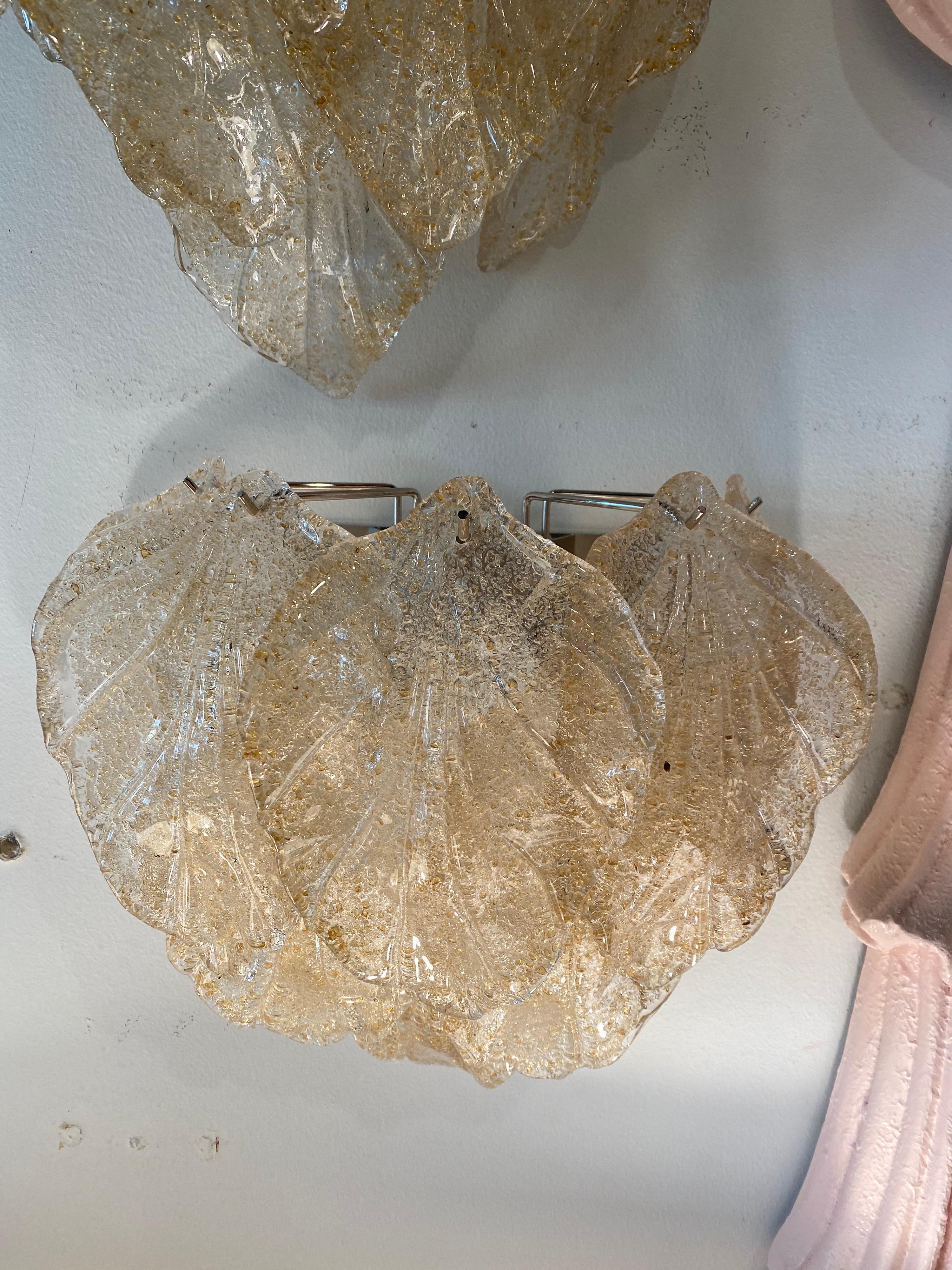 Vintage pair of Murano Mazzega glass leaf leaves wall sconces. Holds 2 bulbs each. No chips or breaks on leaves. The leaves have a lovely texture with gold flakes inside the glass. I do have another pair available if you need 2 pairs.