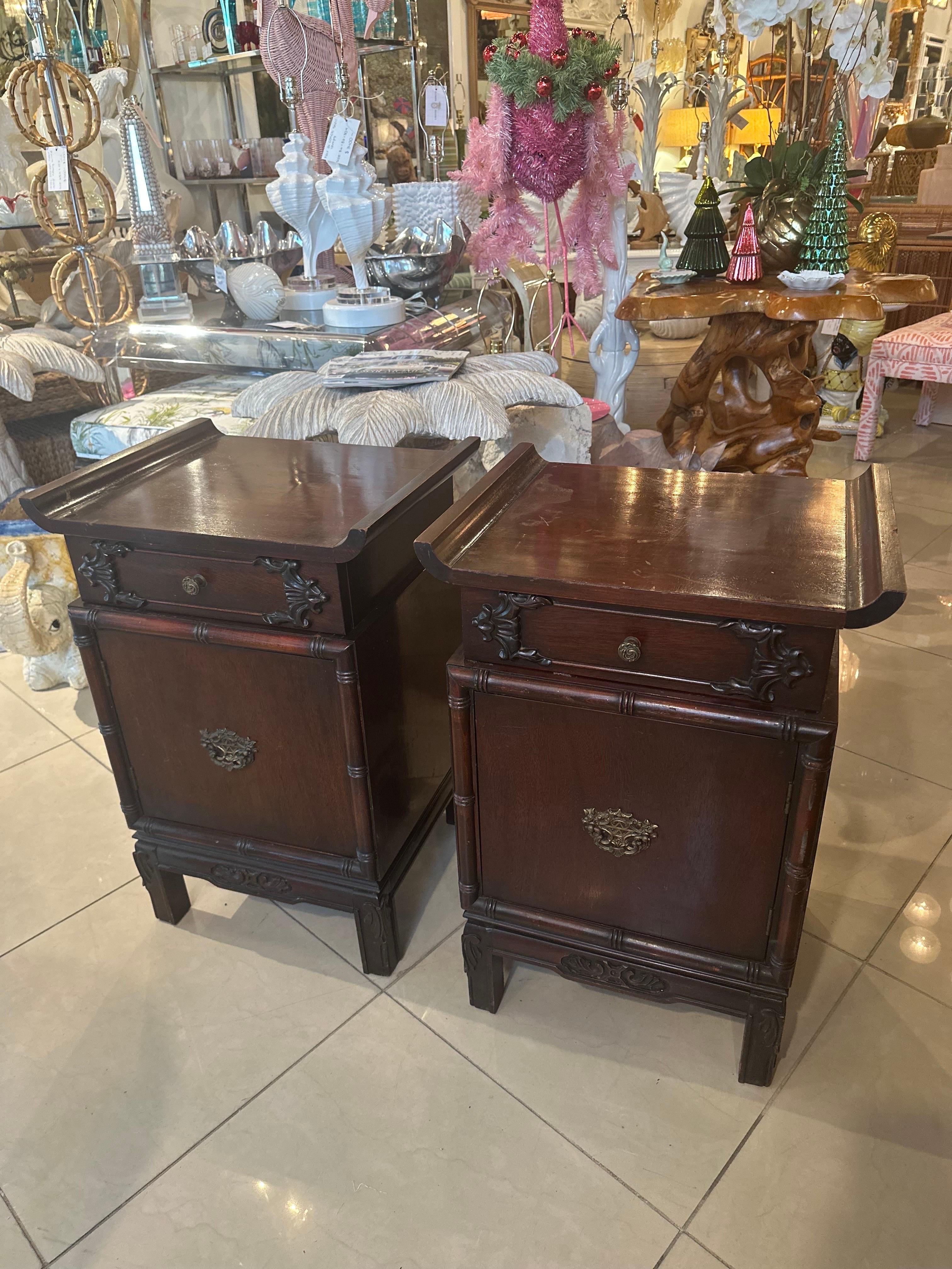 Lovely pair of 1940s mahogany night stands with one drawer and shelf inside door each. Lovely pagoda brass hardware with altar tops. These have their original finish and will need to be refinished, painted or lacquered as there is some normal age to