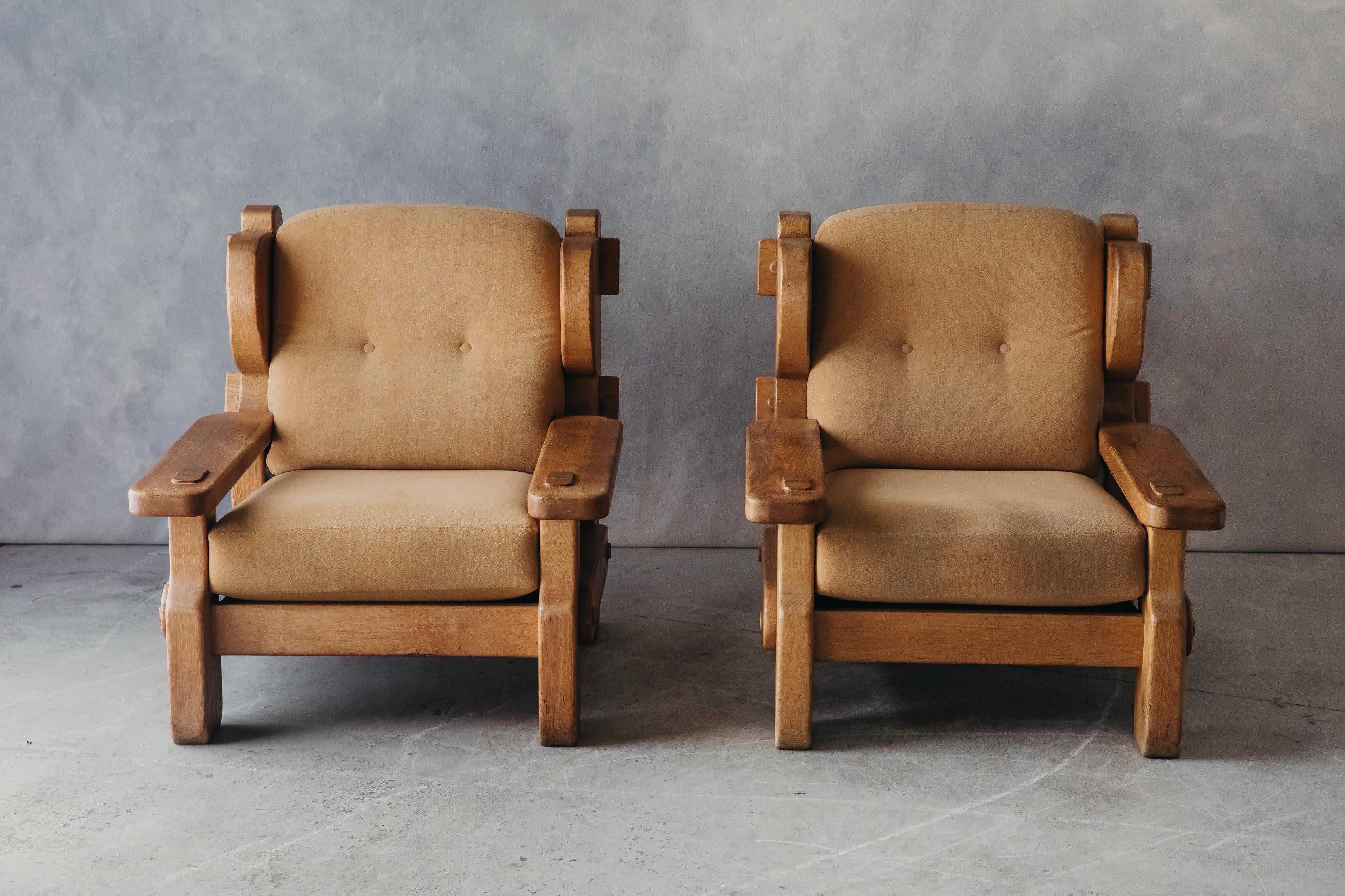 Vintage pair of Oak Lounge chairs from France, circa 1960. Large model with solid oak construction. Light wear and use.

We don't have the time to write an extensive description on each of our pieces. We prefer to speak directly with our clients.