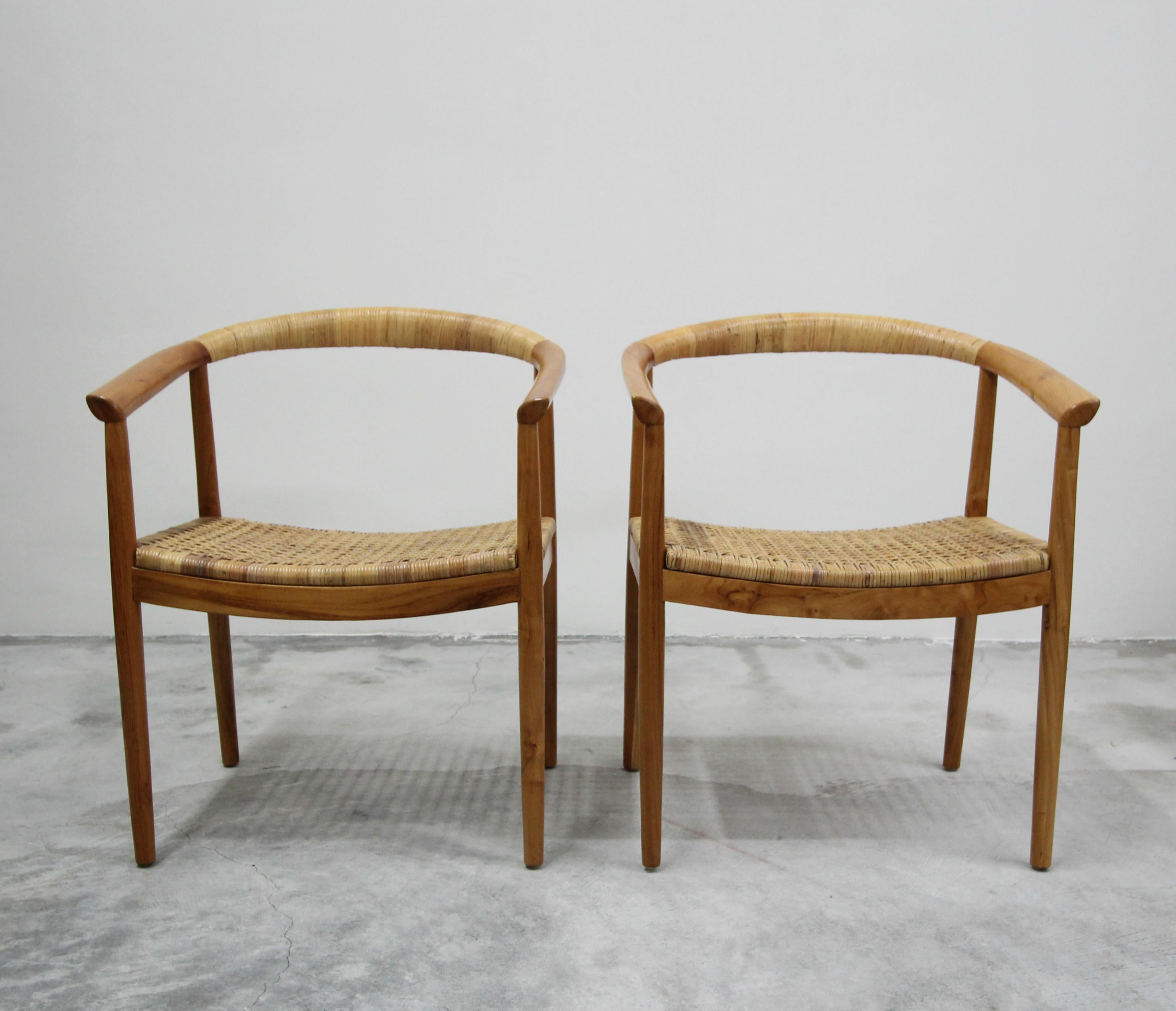 Absolutely fabulous pair of teak and cane side chairs. These chairs are large but so minimalistic. They would truly made the perfect pair of side chairs in any living space. So petite in construction they almost disappear, but nothing short of great