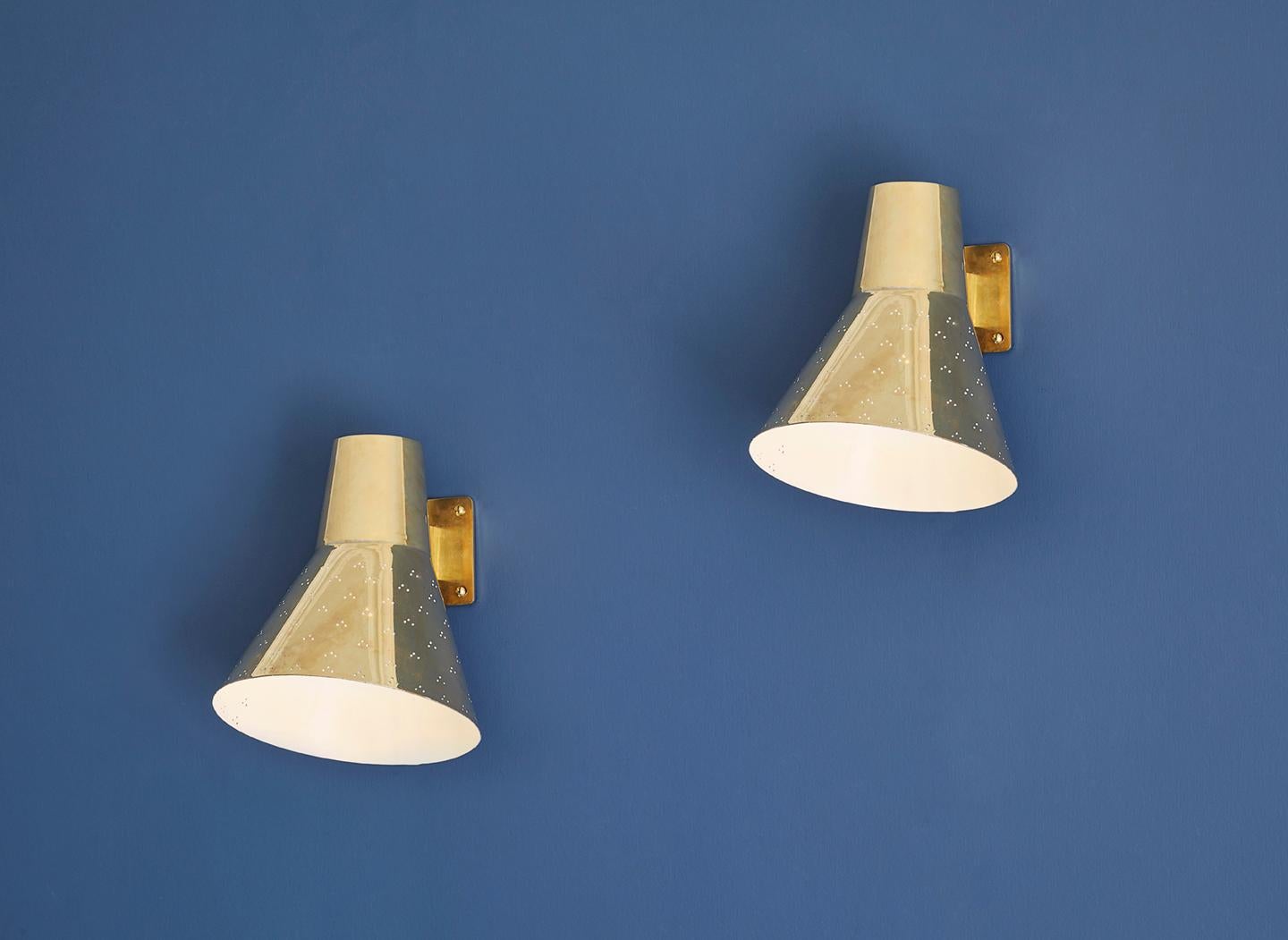 Paavo Tynell
Finland, Vintage

A pair of wall lights in brass with perforated shade. Manufactured by Taito. 

Industrial designer Paavo Tynell (1890-1973) is known as the great pioneer of Finnish lighting design and fondly dubbed as “the man who