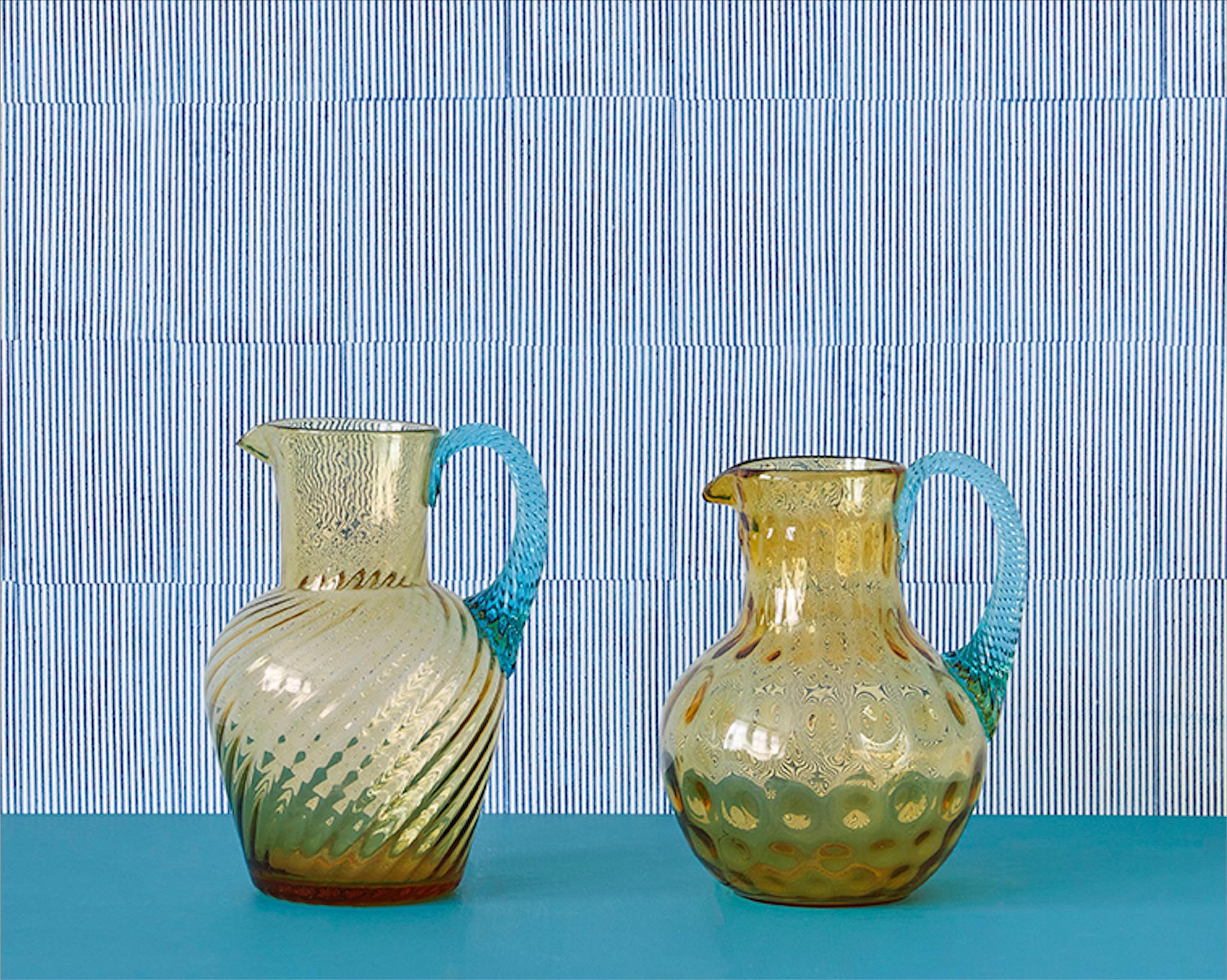 Vintage, France
Early 20th century

A pair of glass pitchers in amber and turquoise glass.

H 21 x Ø 16 cm