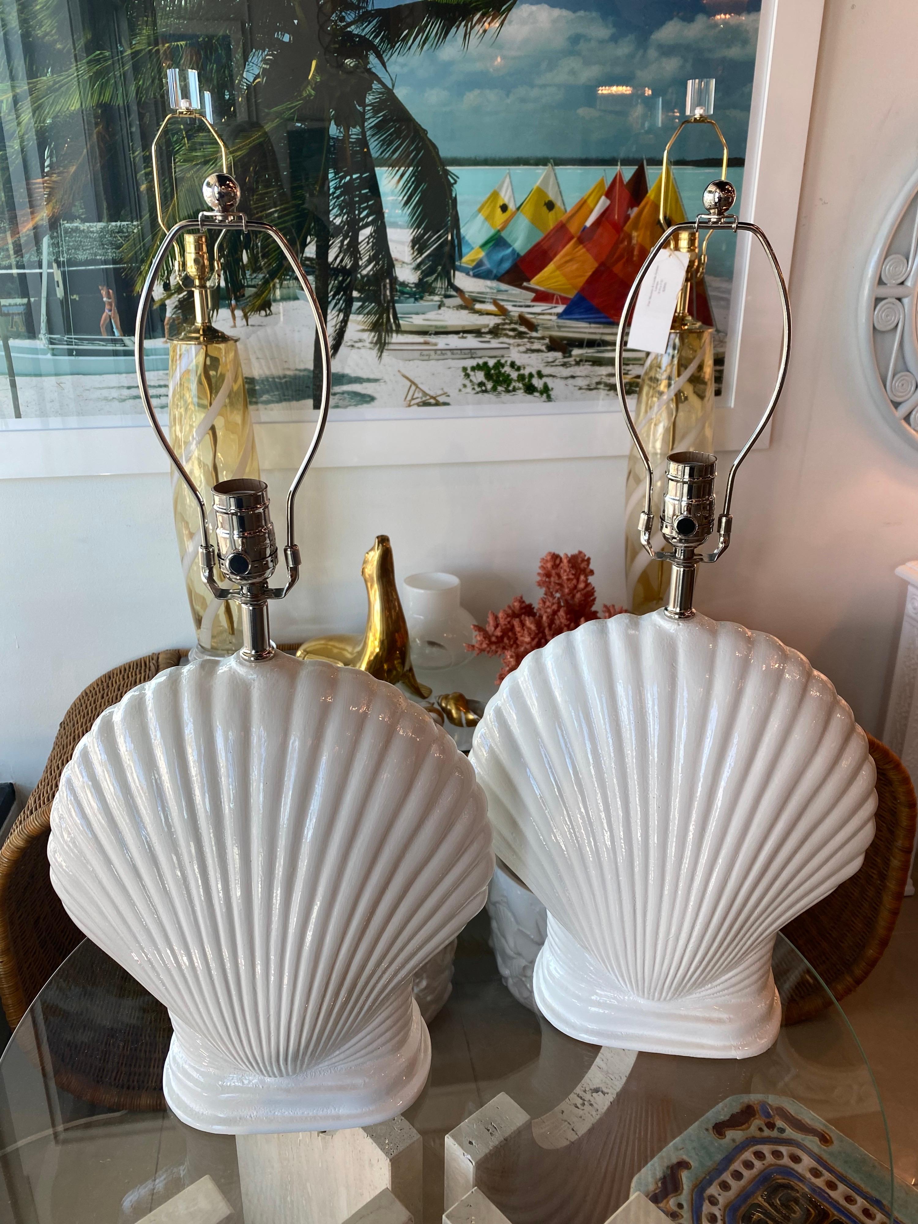 Lovely pair of plaster vintage seashell scallop shell table lamps. These have been newly wired, all new nickel hardware and 3 way sockets. Dimensions: 24