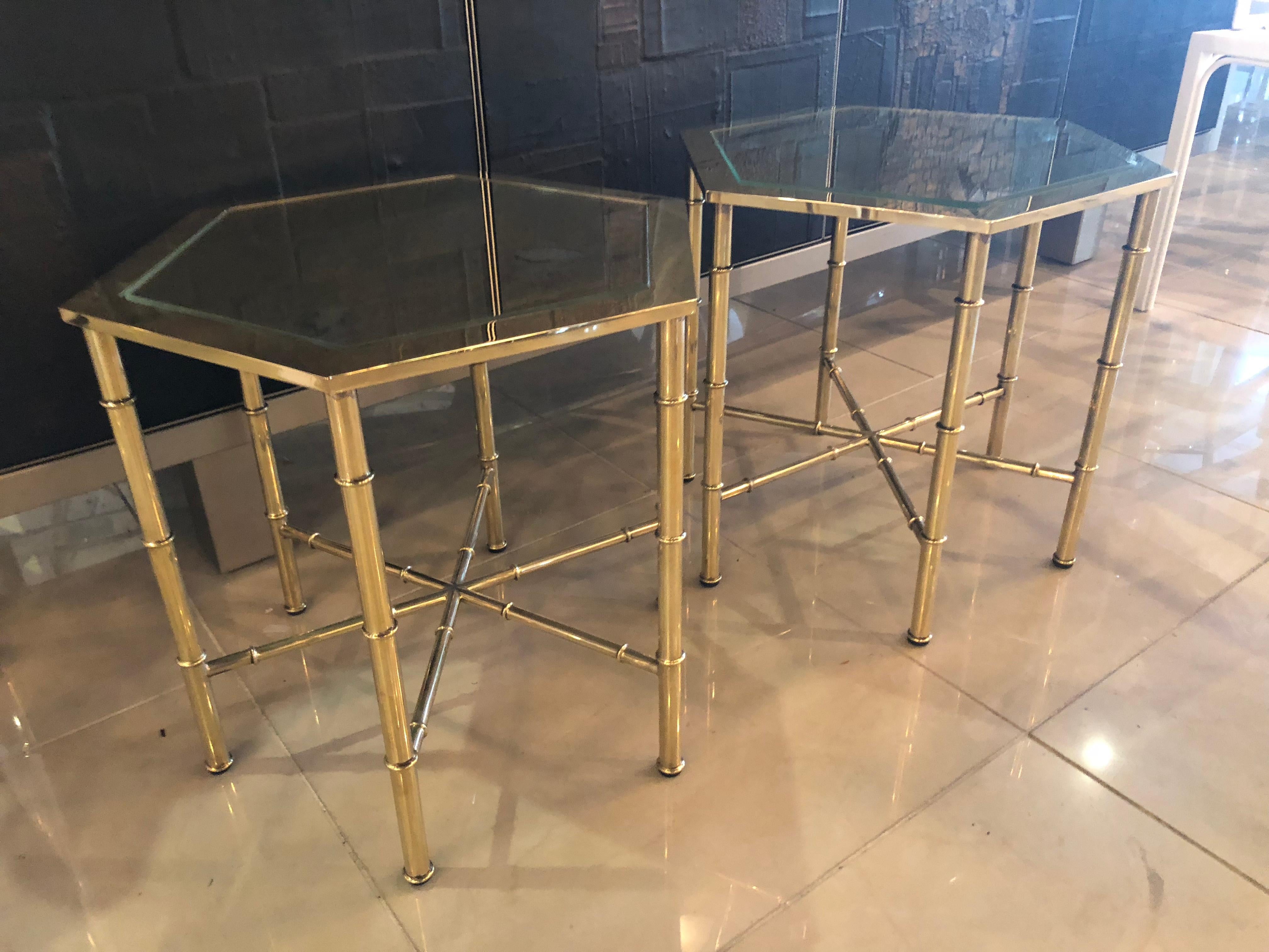 Vintage pair of octagonal brass Mastercraft end side beverage tables. These have been professionally polished and have beautiful antique mirror places in them. Absolutely gorgeous!
 