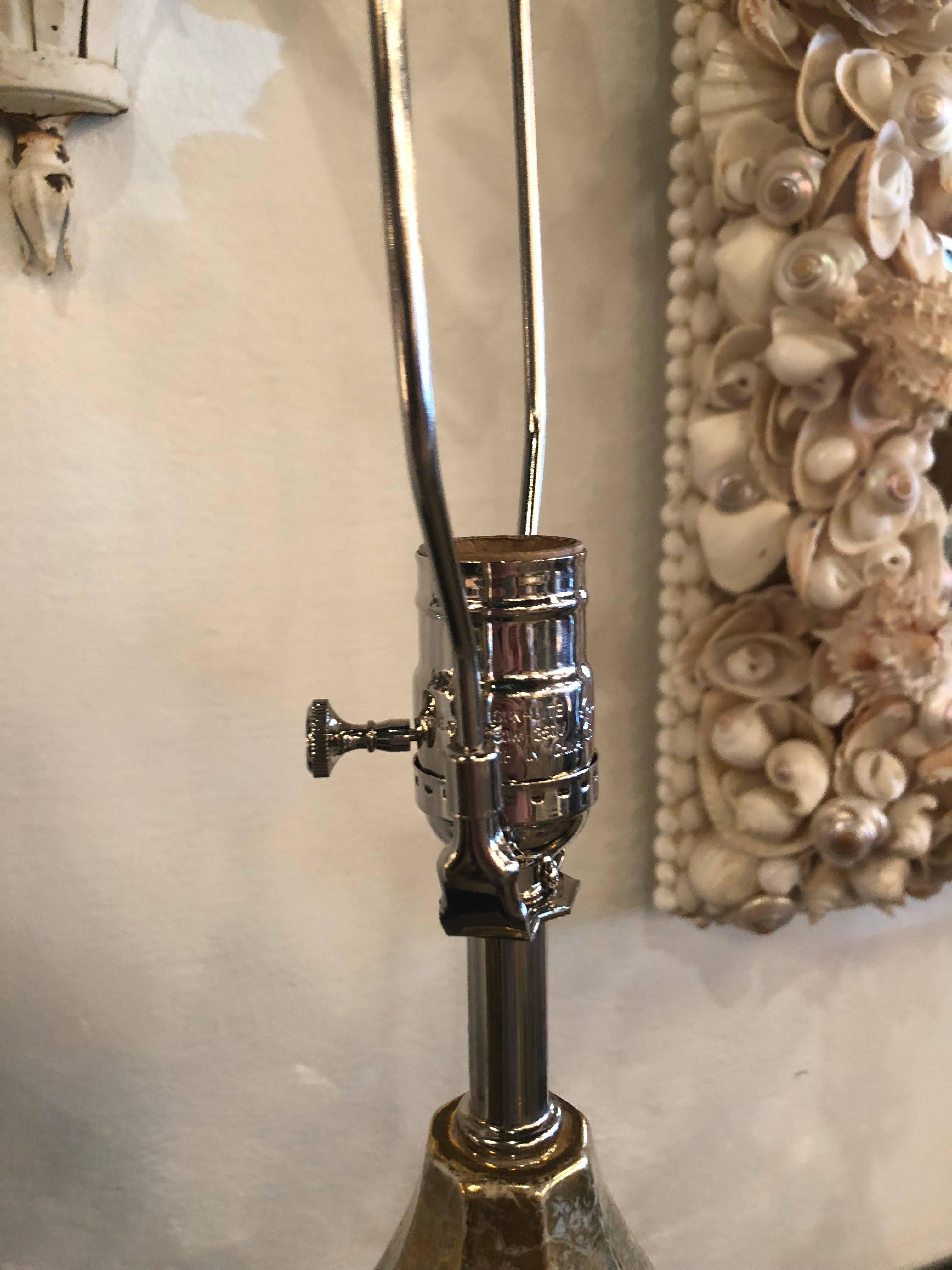 The epitome of Hollywood Regency glamour! Vintage pair of meticulously restored table lamps. Newly wired, all new chrome hardware, custom Lucite base. Lovely gourd shape with a silver and gold crackle looking finish. Height below is to socket.