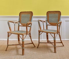 Vintage Pair of Rattan Armchairs with Elegant Green Woven Details, France, 1930s