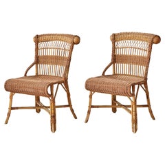 Vintage Pair of Rattan Chairs with Elegant Curved Details, France, 1940s