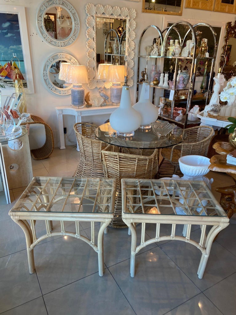 Pair of vintage rattan end side tables with glass top. Natural rattan finish. If you would like an additional shipping quote please contact me for one.