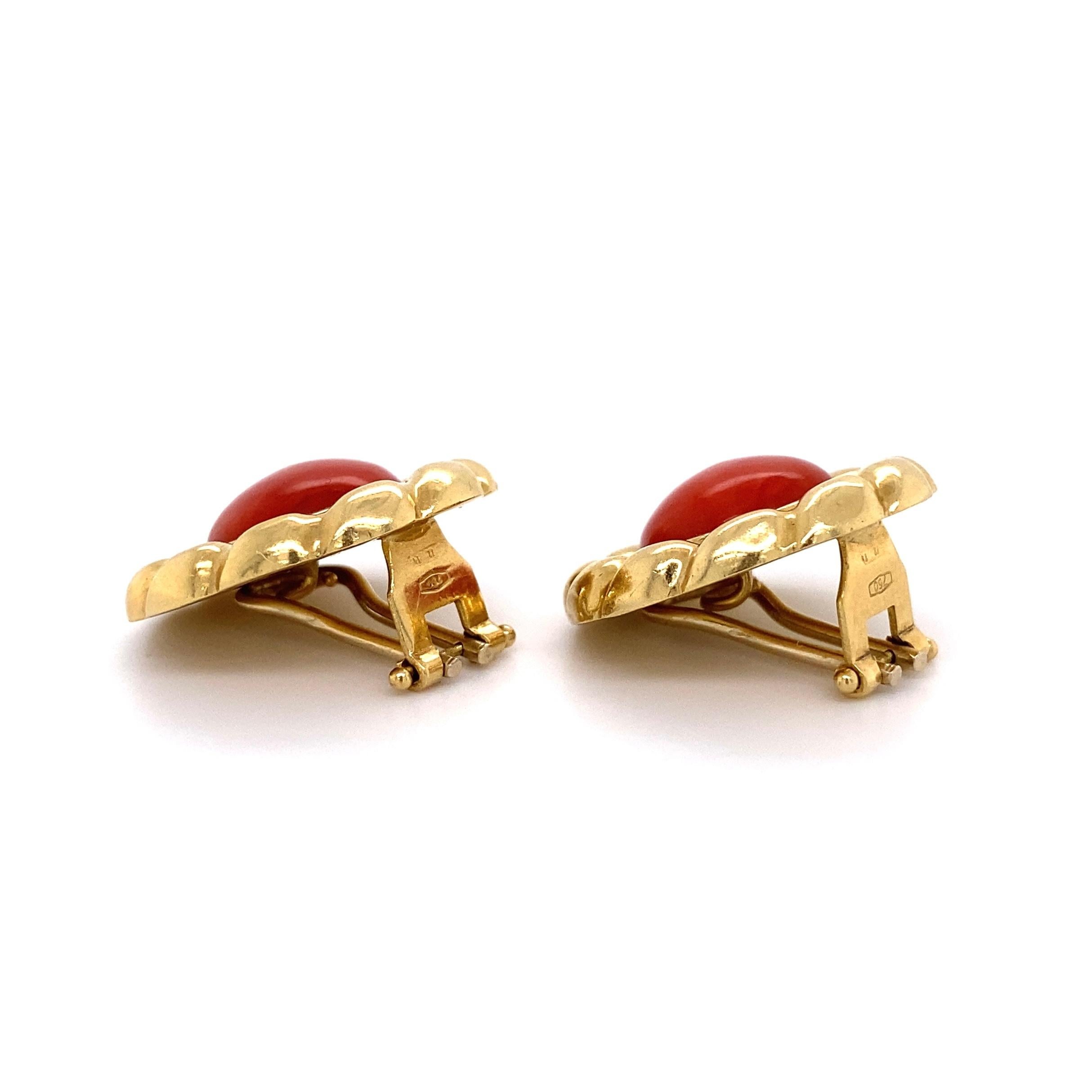 Simply Beautiful Pair of Red Coral Button Earrings. Centers securely Hand set with a round Cabochon Coral Gemstone. French Clip backs. Marked: 750 (European standard for 18 Karat Gold). Hand crafted in 18K yellow Gold. Approx. dimensions: 0.87