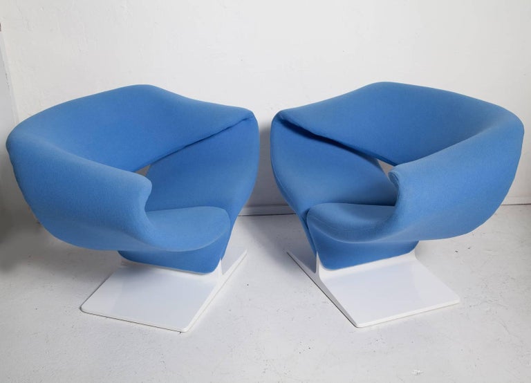 Vintage pair of 1960s Ribbon chairs by Pierre Paulin have freshly re-lacquered white wood bases and an earlier upholstering in pale blue wool. Bases retain original Artifort labels, as well as the label for Turner Ltd., the New York showroom from