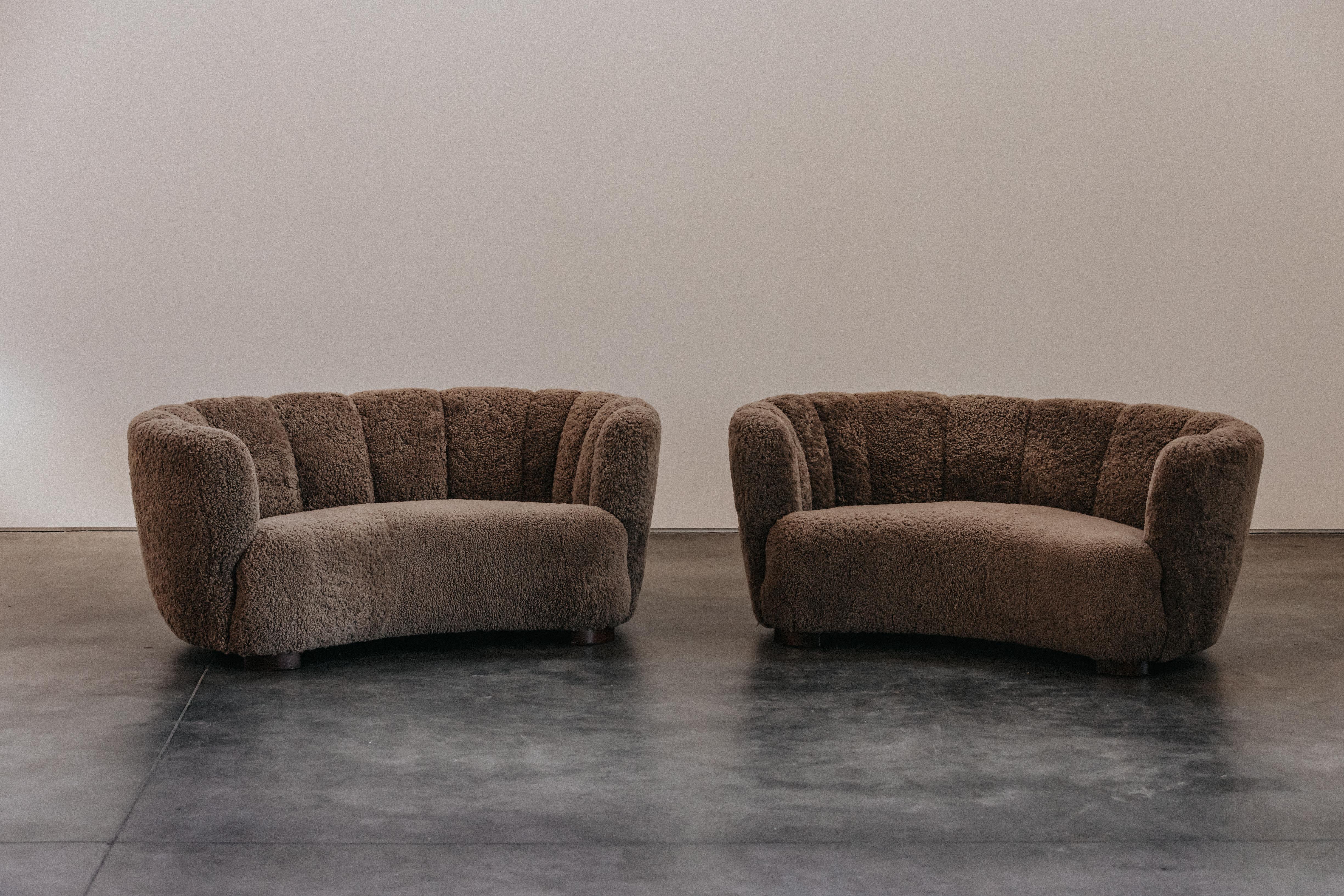 Vintage Pair Of Sheepskin Cabinetmaker Sofas From Denmark, Circa 1960.  Nice identical pair by a Danish cabinetmaker, later upholstered in soft brown grey shearing.  Excellent condition.