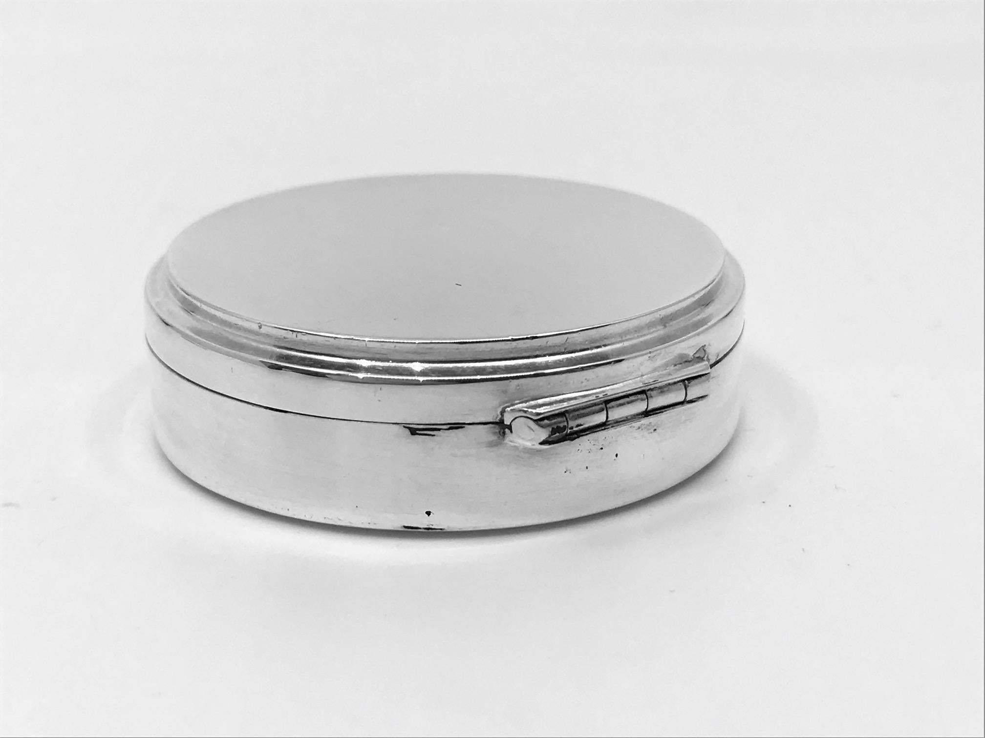 This is a pair of small sterling silver boxes with Georg Jensen signature, both pieces designed by Harald NIelsen. As well as the signature, both pieces are engraved with the date 13.5.35 ( 13th May 1935). The round box is marked with design #134B,