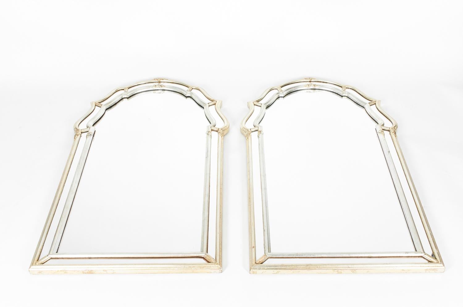 Vintage pair two-tone silvered / gold wood framed Italian hanging wall mirror. Each mirror is in excellent condition. Each mirror measure about 43 inches length x 24 inches width.