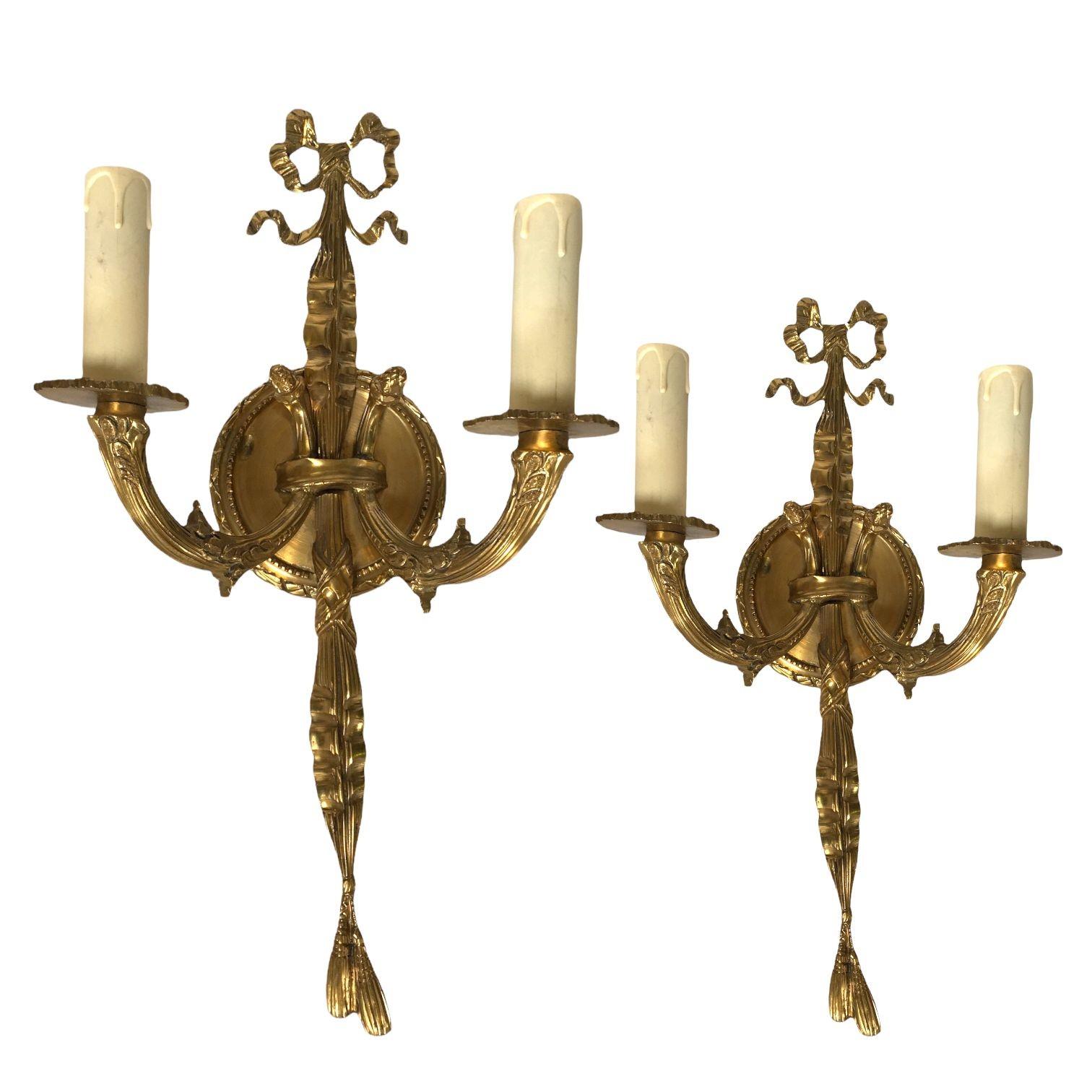 Vintage Pair of Solid Brass Wall-mount Sconces.

These Louis XVI-style brass wall sconces epitomize timeless elegance with meticulous craftsmanship. Their intricate brasswork and opulent design make them a historically sophisticated addition to any
