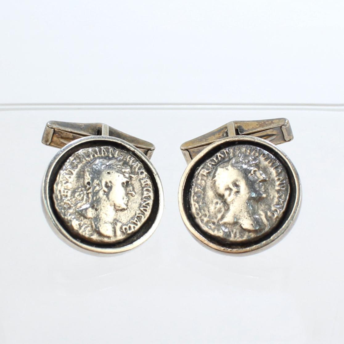 A fine pair of vintage sterling silver cufflinks.

Set with what we believe to be ancient Roman Denarius silver coins bearing the bust of the 2nd Century BCE Roman Emperor Hadrian.

Simply a fascinating pair of cufflinks!

Date:
20th