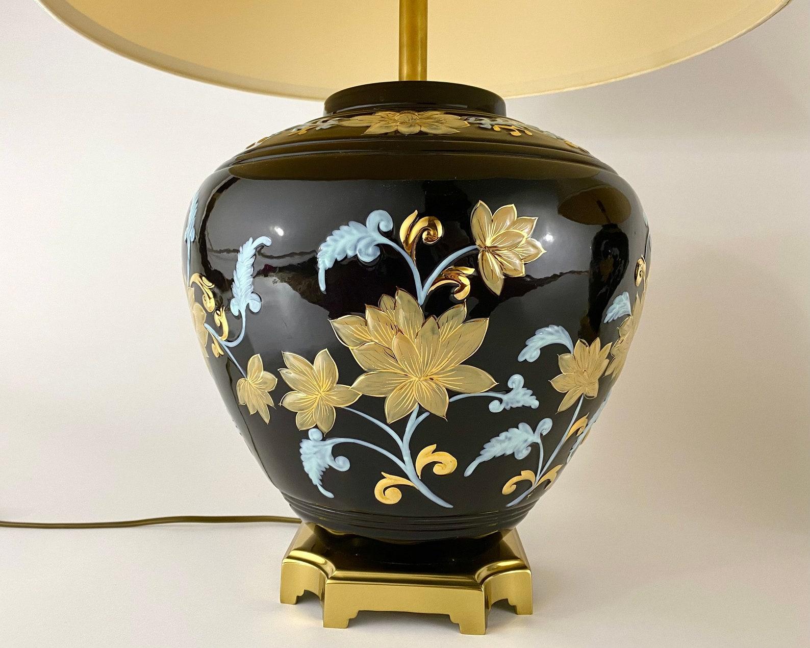 A charming and elegant pair of lamps. The porcelain body is hand painted and has a nice shine. 

 The quality can definitely be seen through the paintings, design, shape and the colour palette. The lamp is enhanced with several ornate bronze parts.